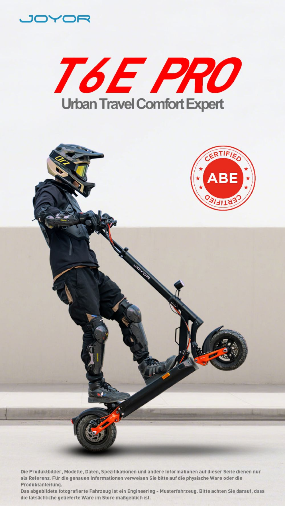 Un pilota con equipaggiamento protettivo fa una impennata su un monopattino Joyor T6E Pro.