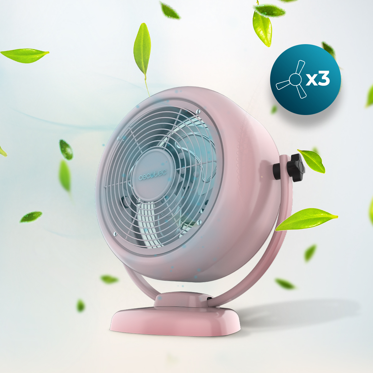 Un ventilatore da tavolo rosa rotondo si trova su uno sfondo bianco con foglie verdi fluttuanti.