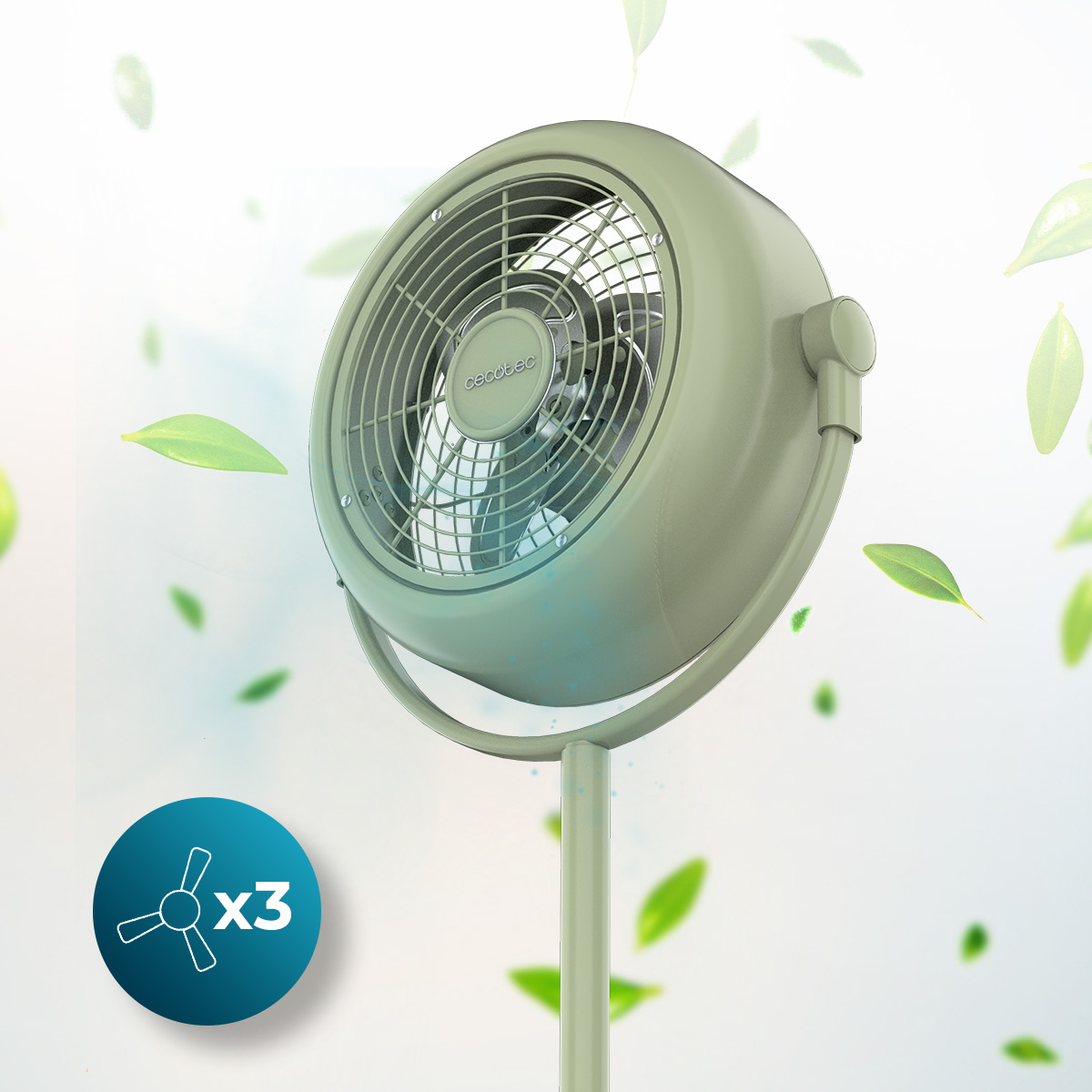 Un ventilatore a piantana verde pastello circondato da foglie verdi fluttuanti.
