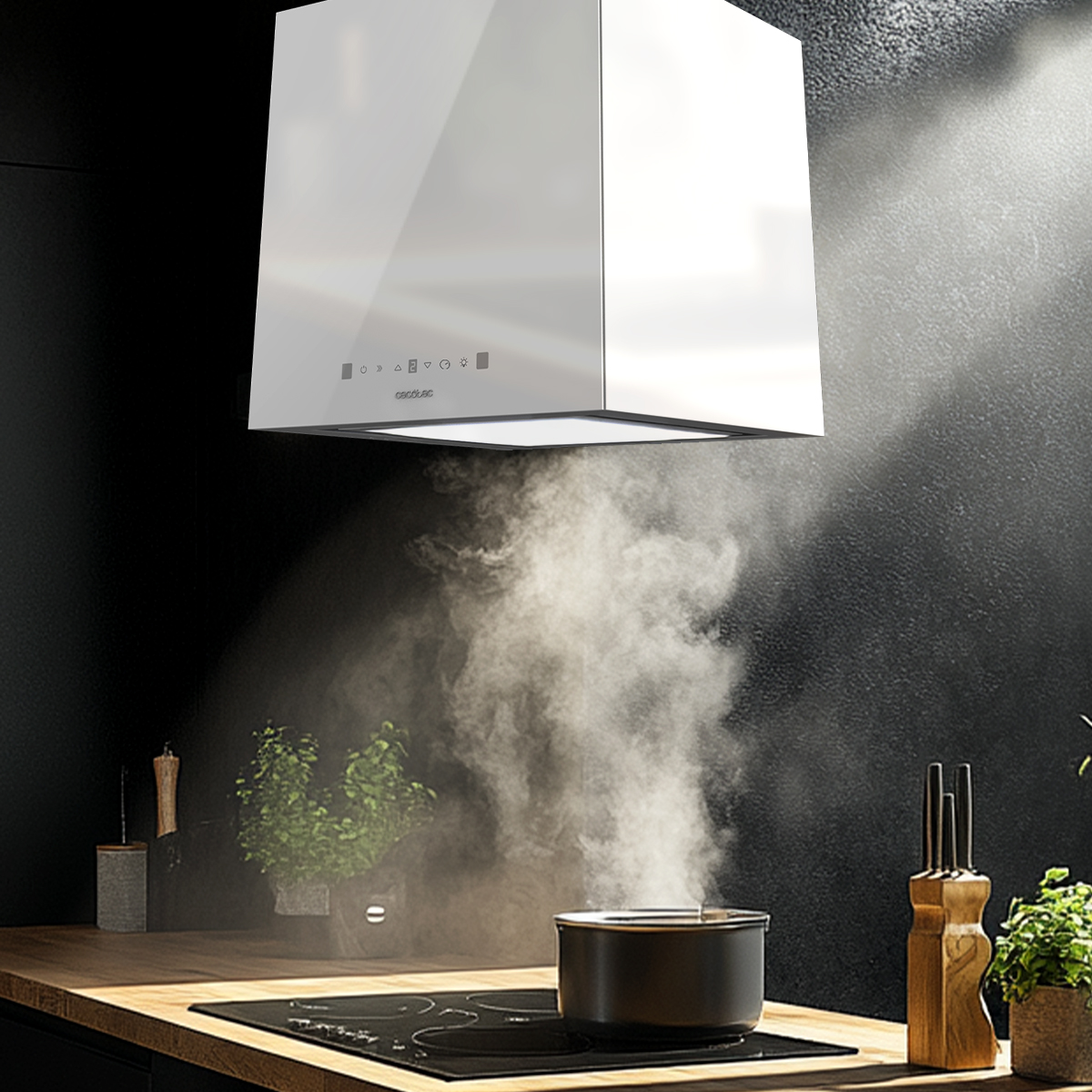 Una campana extractora blanca sobre una olla humeante en una estufa en una cocina oscura.