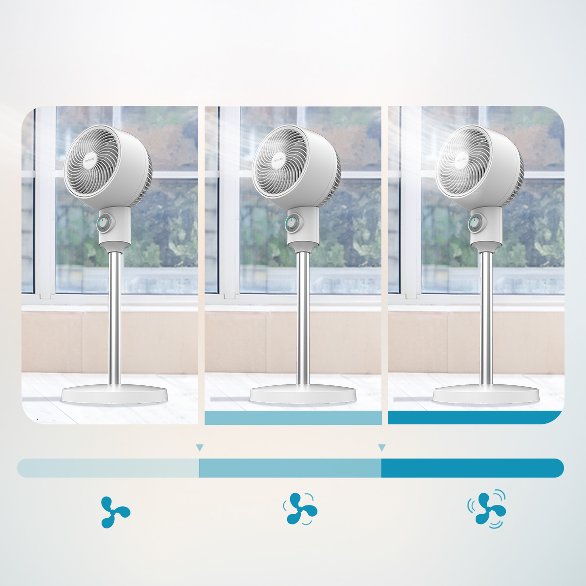 Tres ventiladores de pedestal blancos frente a una ventana con velocidad de viento creciente.