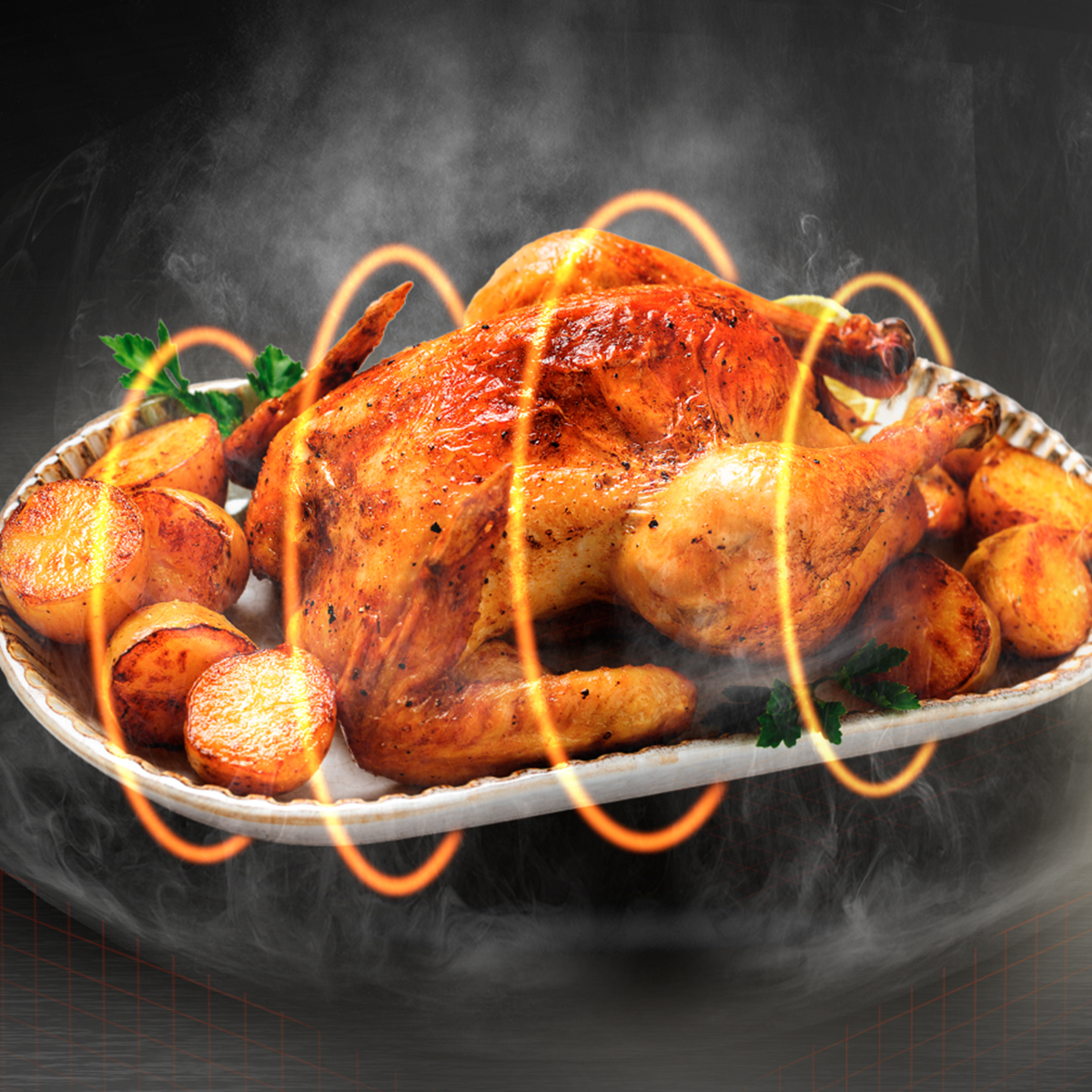 Un pollo entero asado con patatas en una bandeja, rodeado de vapor y anillos naranjas brillantes.