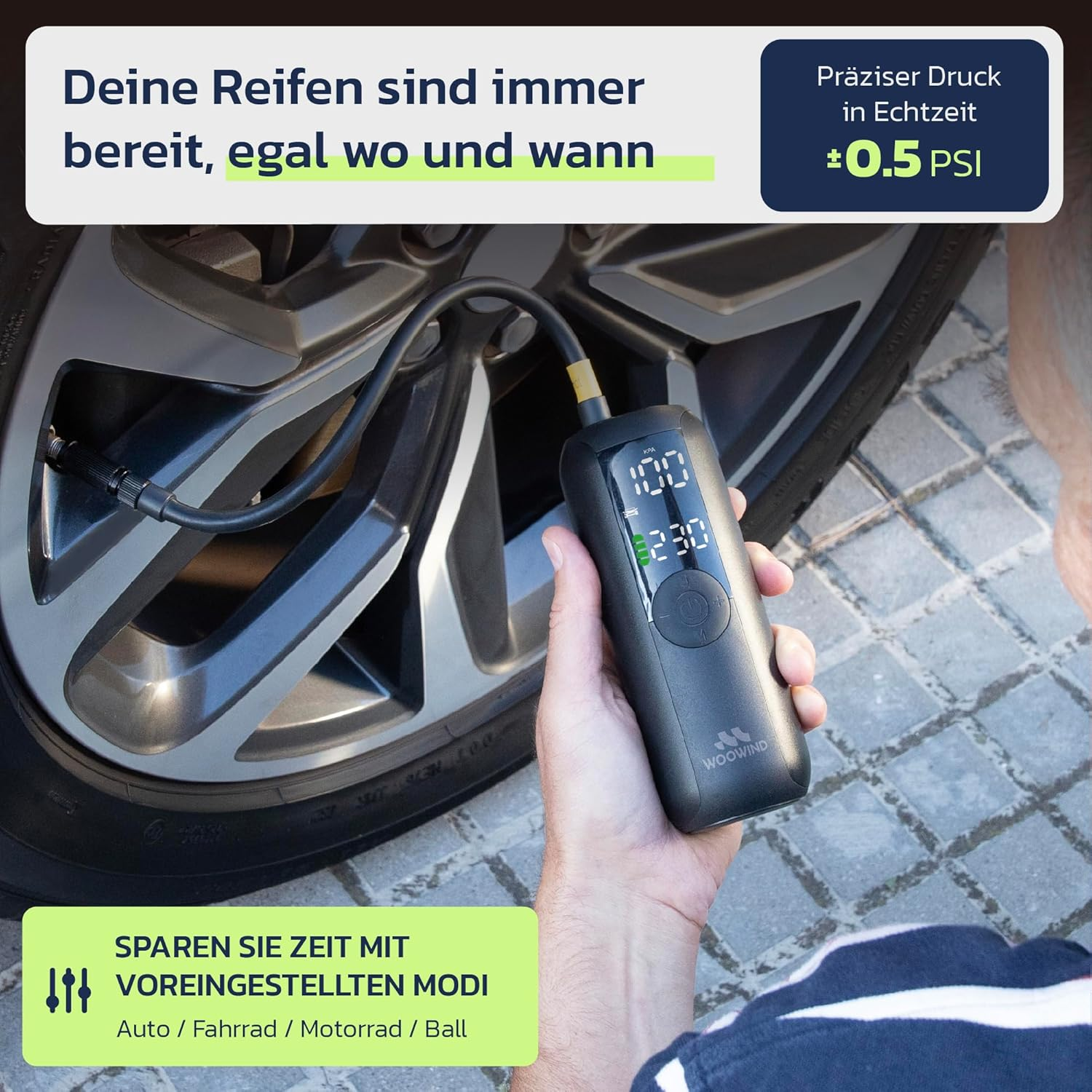 Une personne utilise une pompe à air électrique numérique portable pour gonfler un pneu de voiture.