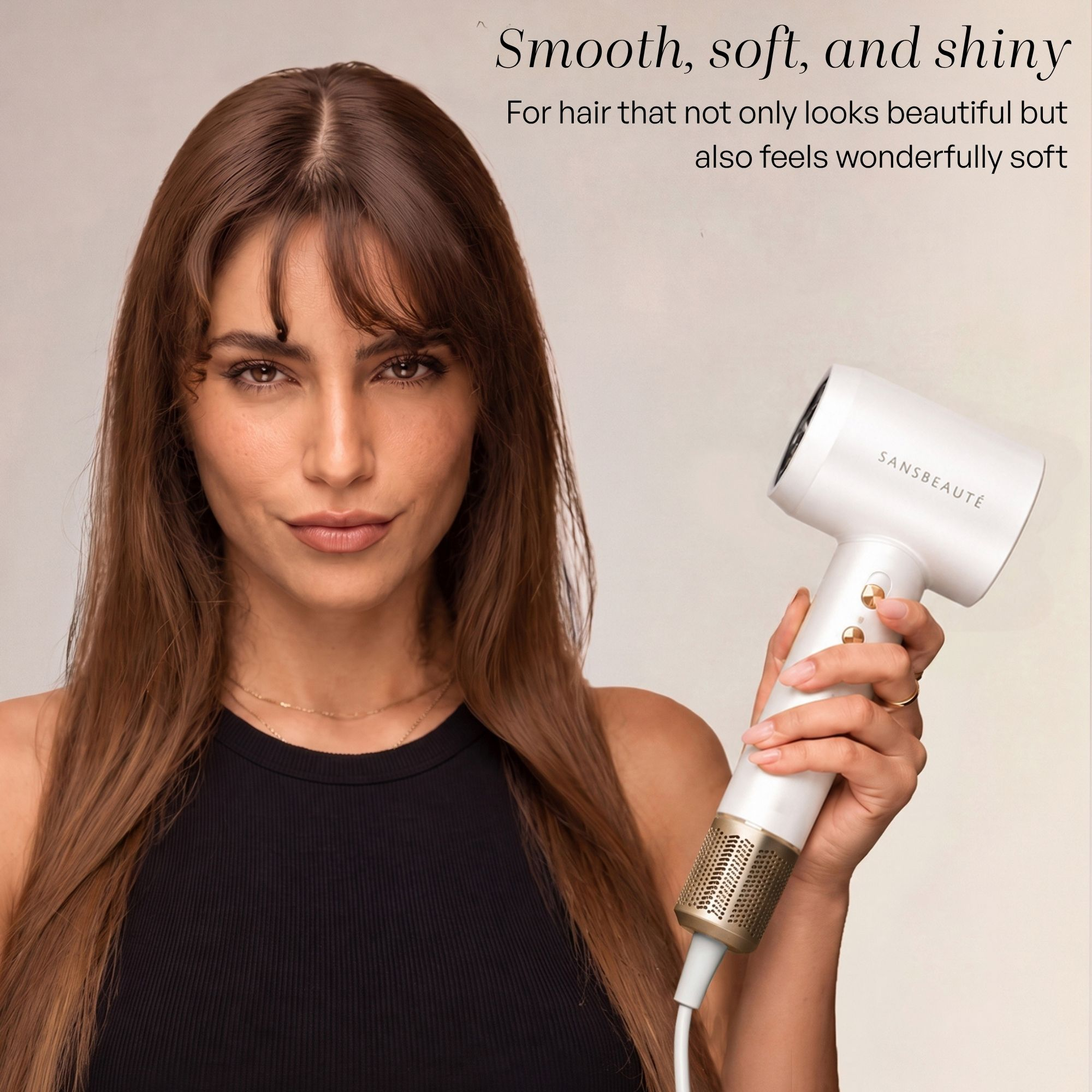A woman with long brown hair holds a white and gold hair dryer against a plain background with promotional text.