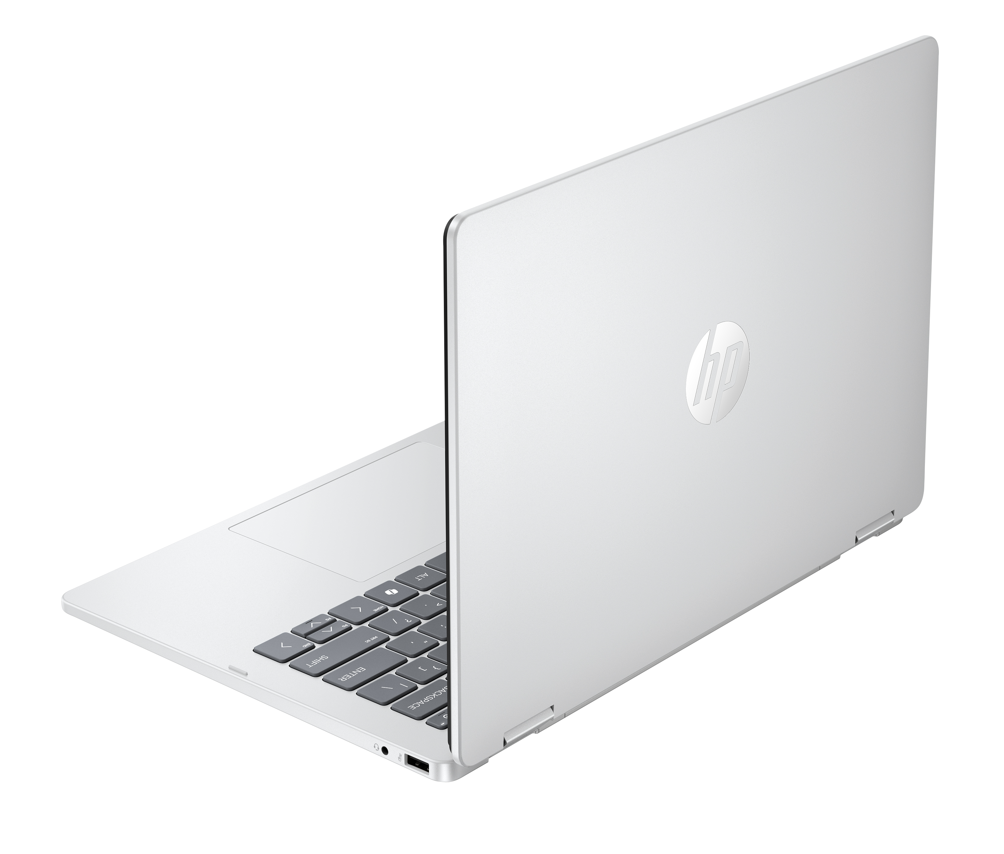 Un laptop HP argentato si trova su sfondo nero, parzialmente aperto e mostra la tastiera.