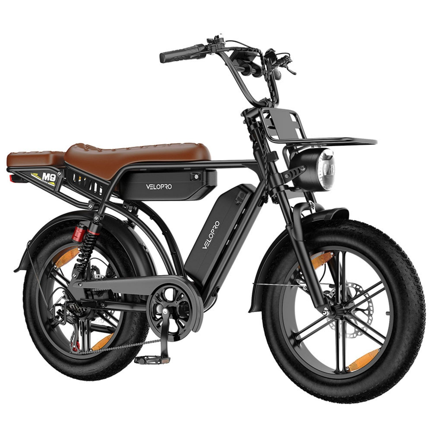 Bicicletta elettrica Velopro nera con sella in pelle marrone e pneumatici larghi su sfondo bianco.