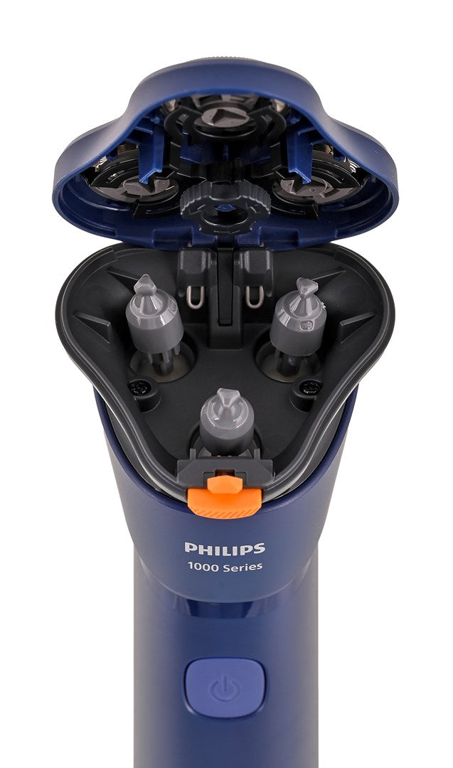 Zblizenie niebieskiej golarki Philips serii 1000 z otwarta glowica, ukazujaca trzy szare trzpienie.