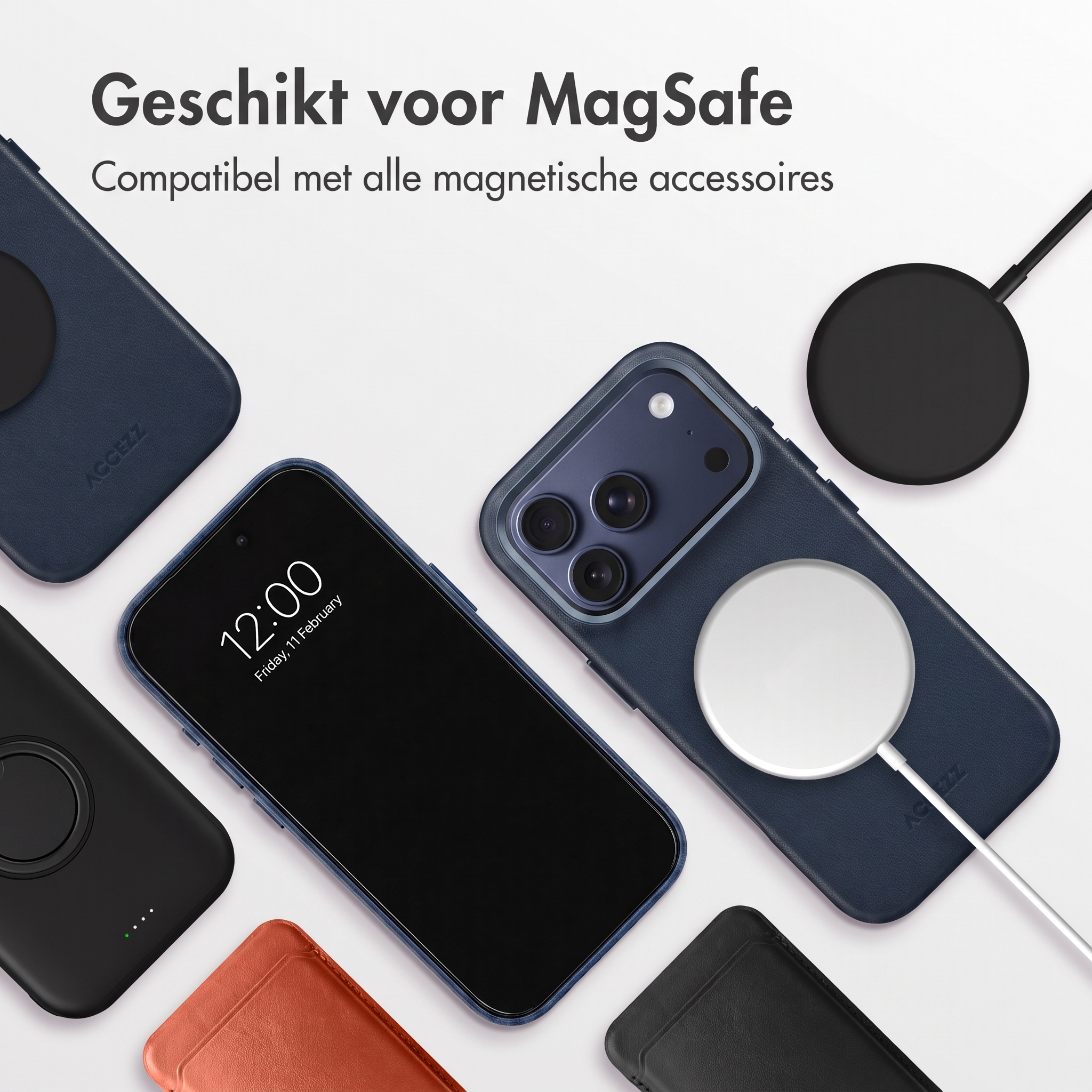 Un smartphone dans une coque bleue avec un chargeur magnétique, entouré d'accessoires.