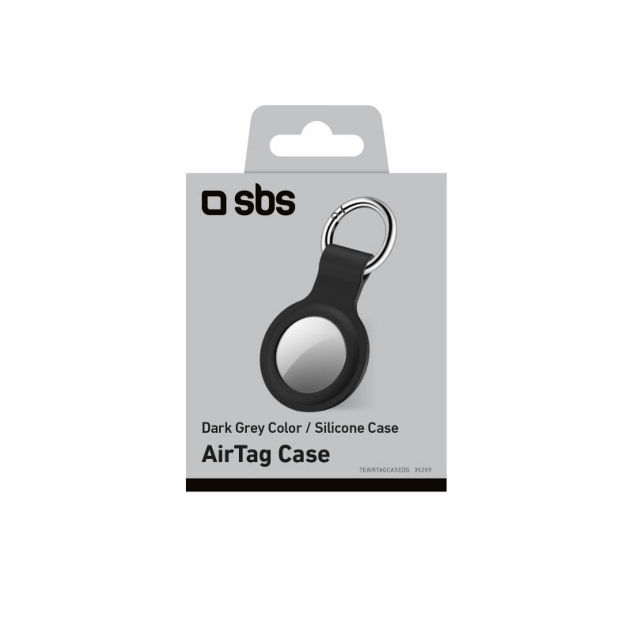 Custodia per AirTag in silicone grigio scuro con portachiavi nella confezione originale su sfondo bianco.