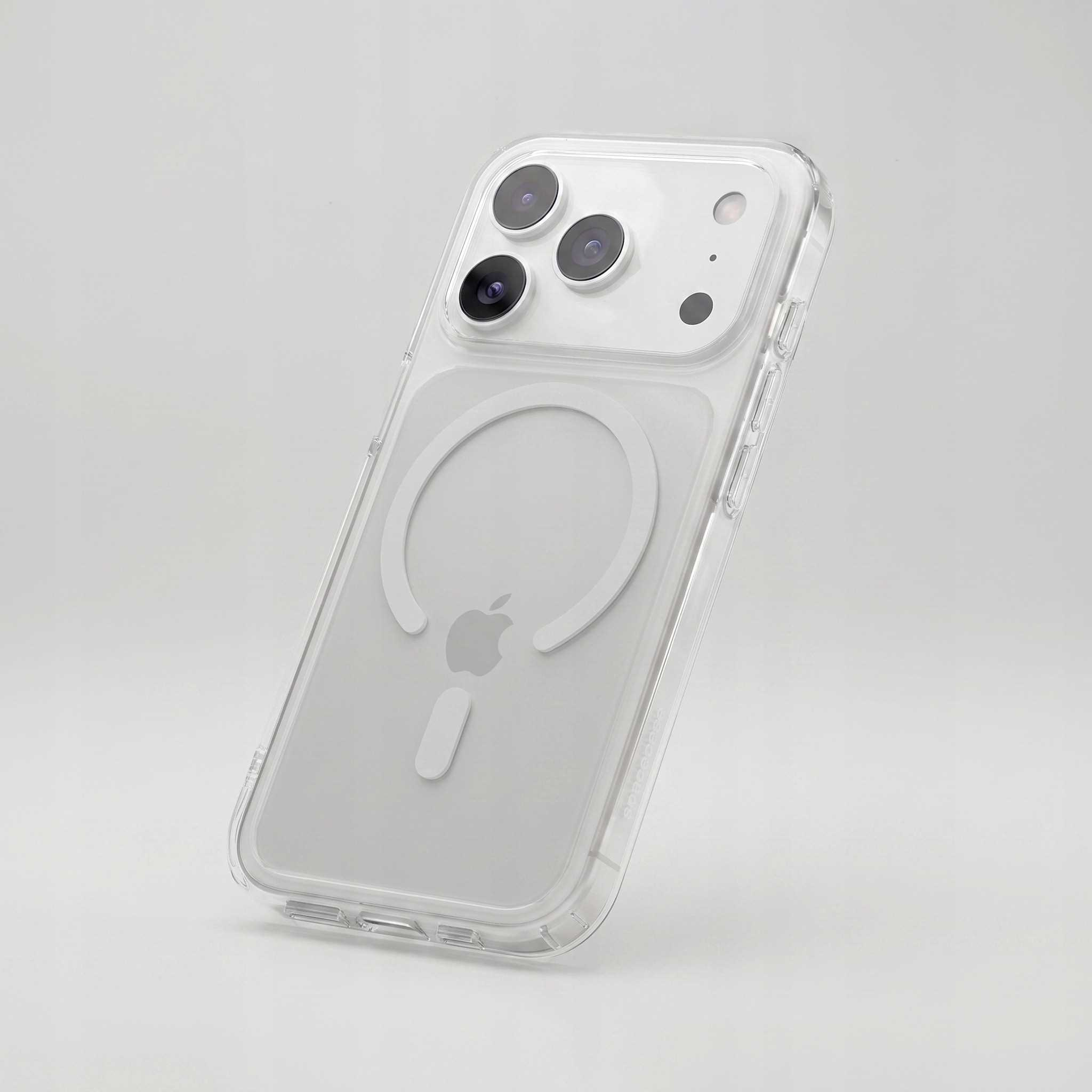 Smartfon w przezroczystym etui z pierścieniem MagSafe z tyłu, na jasnym, szarym tle.