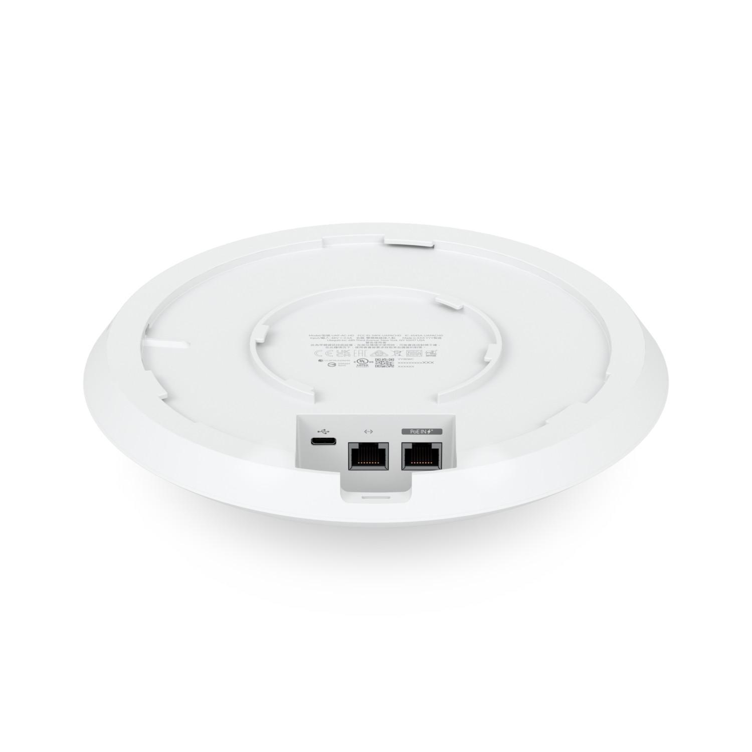 La parte inferior de un punto de acceso inalámbrico blanco y redondo con puertos Ethernet y USB-C sobre un fondo blanco.