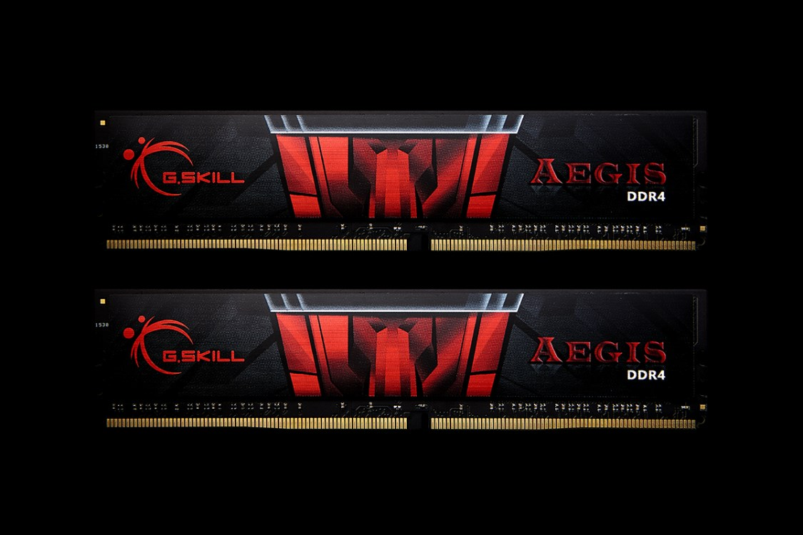 Due stick RAM G.Skill Aegis DDR4 con design nero e rosso su sfondo nero.