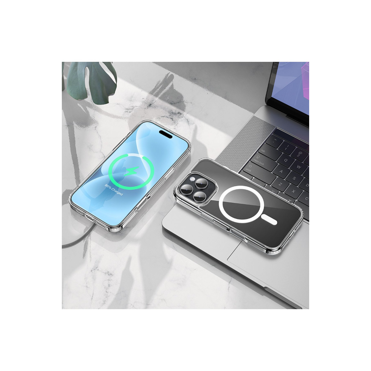 Şarj olan bir akıllı telefon ve MagSafe kılıflı diğeri, dizüstü bilgisayarın yanında bir masada duruyor.