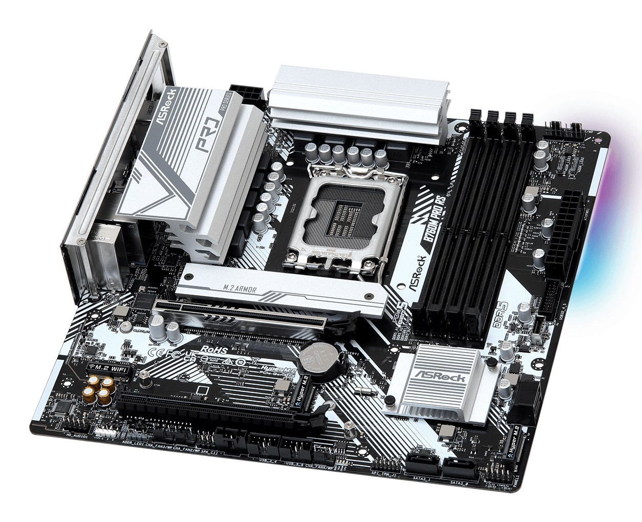 Ansicht eines ASRock B760M Pro RS Mainboards mit silbernen Kühlkörpern, schwarzer Platine und RAM-Steckplätzen.