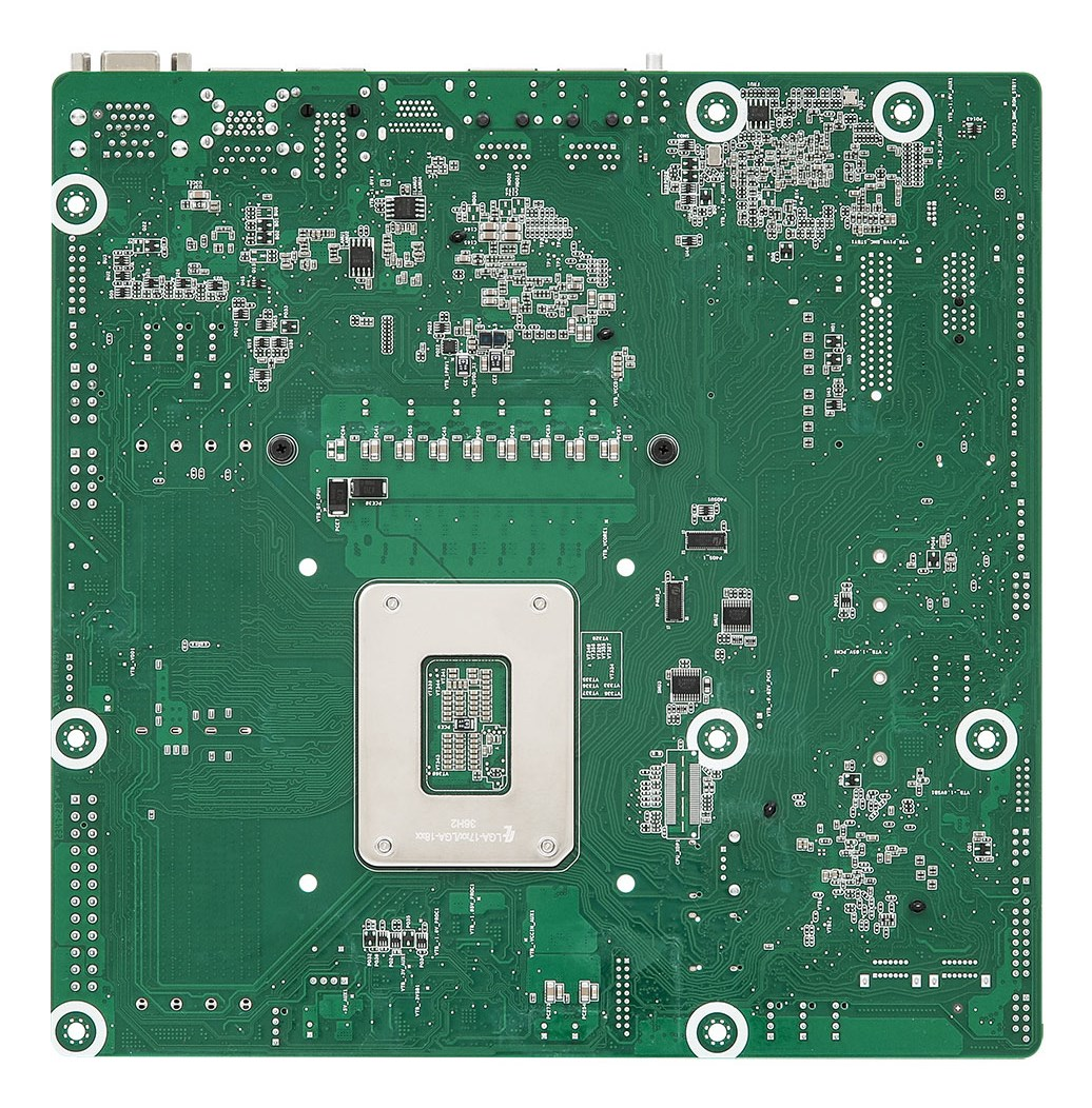 Placa base de computadora verde con un zócalo de CPU plateado y componentes.