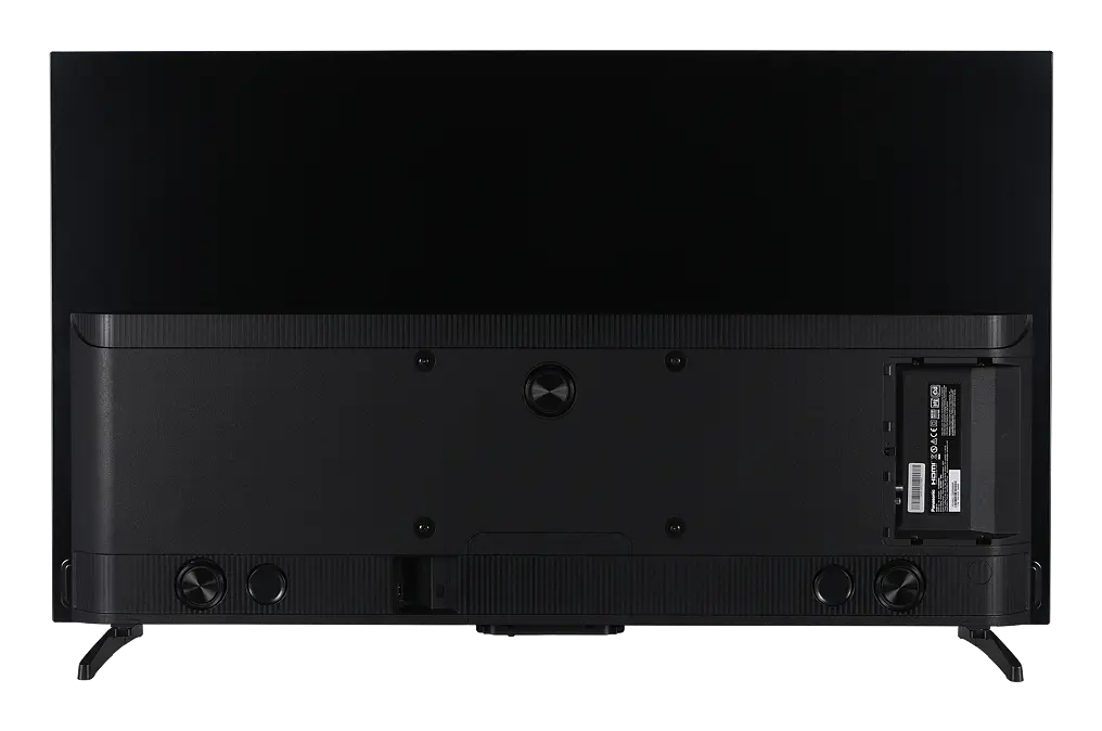 Vista trasera de un televisor negro moderno con soportes y puertos.