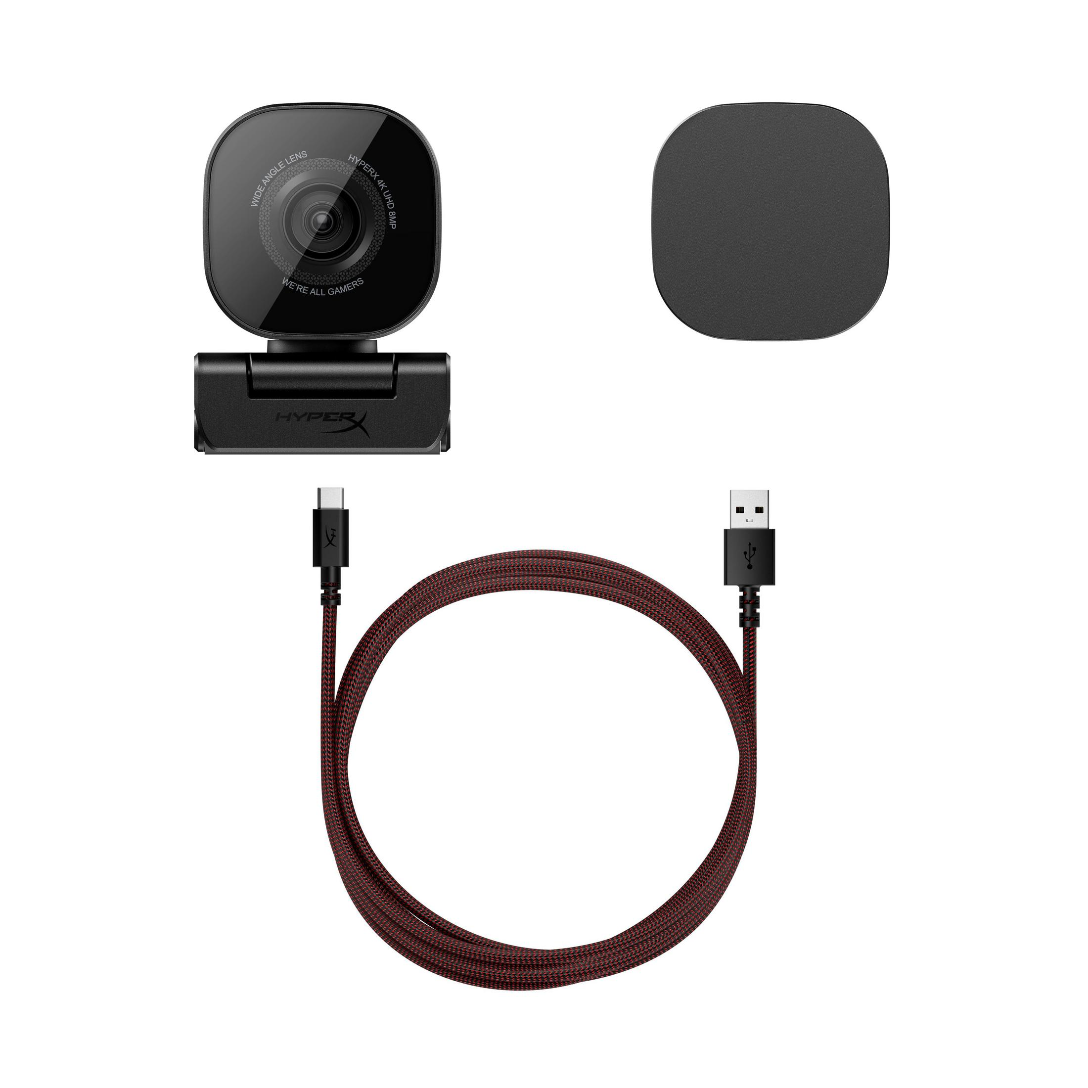Eine schwarze Webcam mit Ständer, ein quadratisches Cover und ein rot-schwarzes USB-Kabel.