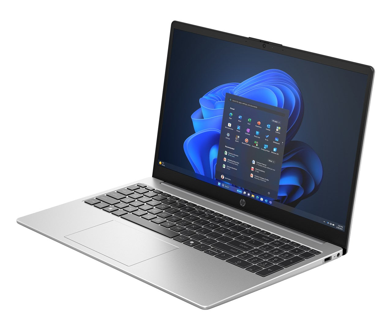 Srebrny laptop z czarną klawiaturą i menu Start systemu Windows 11 na niebieskiej tapecie.