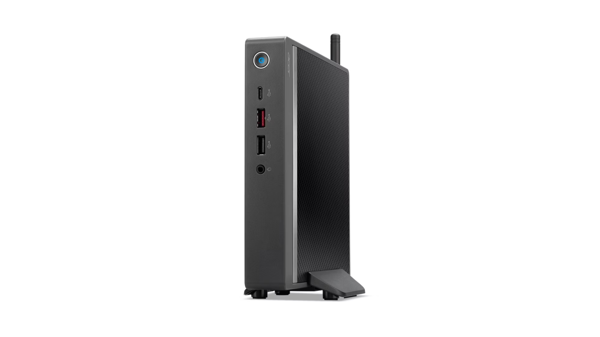 Un mini PC nero in posizione verticale con porte USB e pulsante di accensione visibili sul pannello frontale.