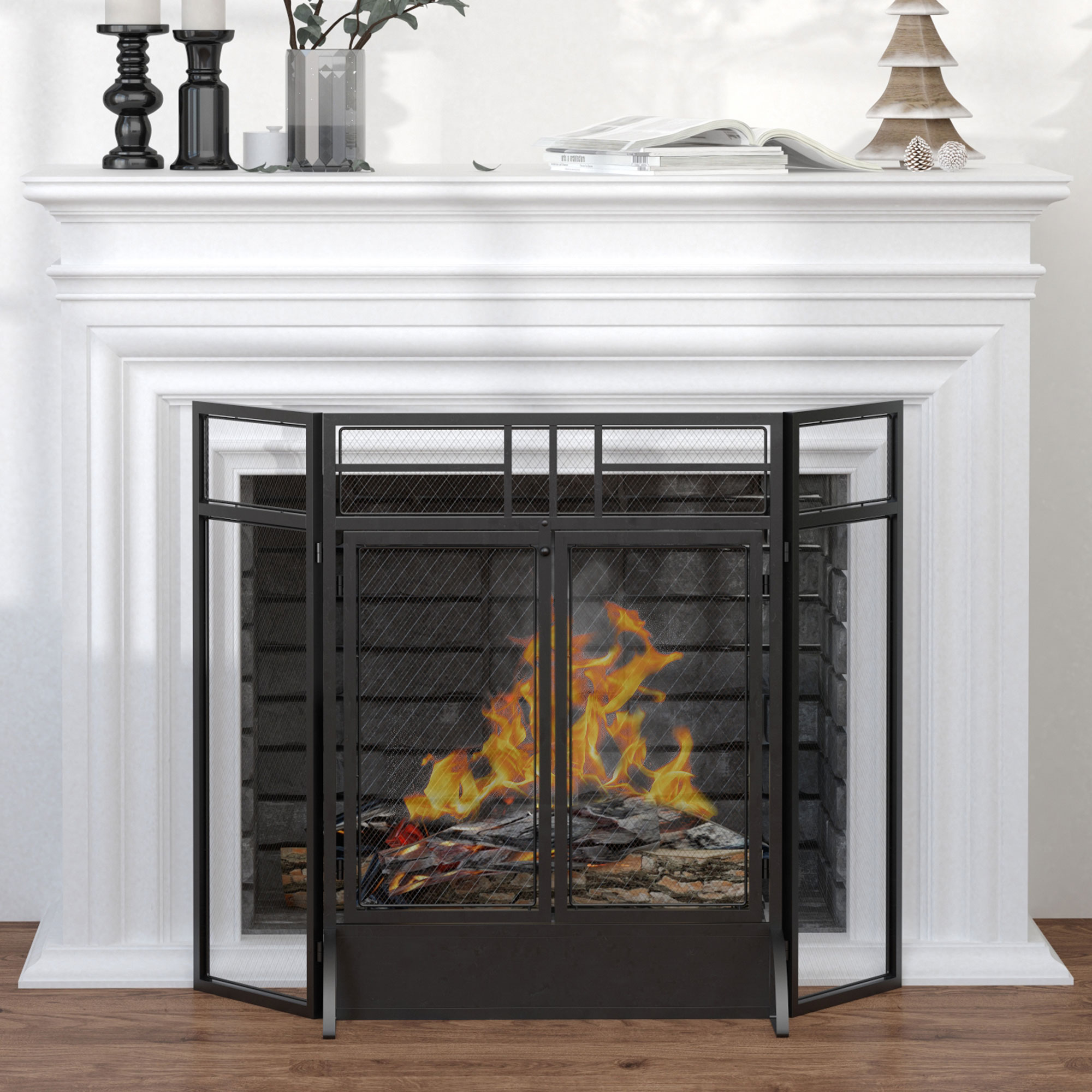 Una chimenea blanca con fuego ardiente, pantalla negra y decoraciones en la repisa.