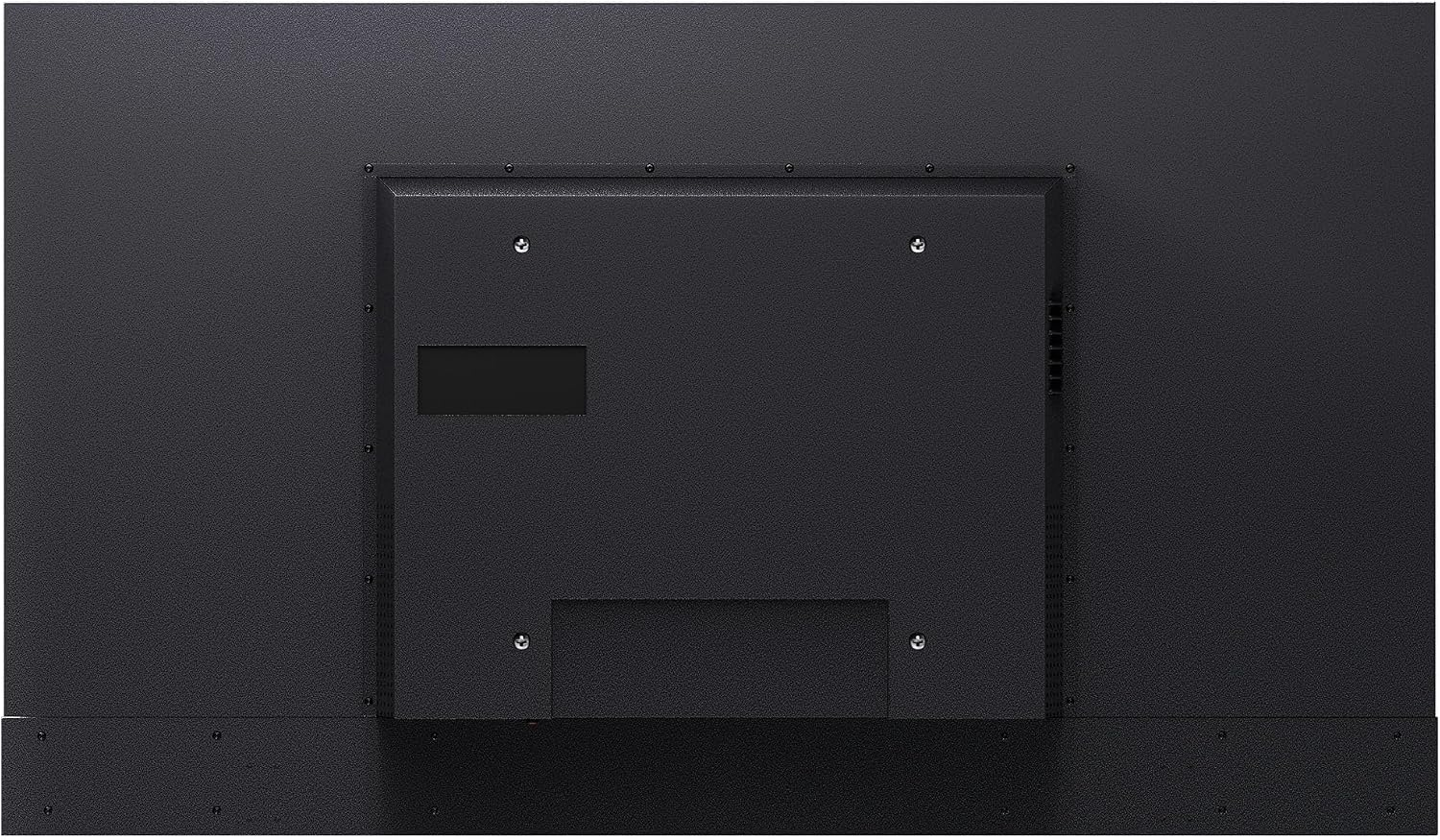 El panel posterior plano de un monitor negro con orificios de montaje VESA y ranuras de ventilación.