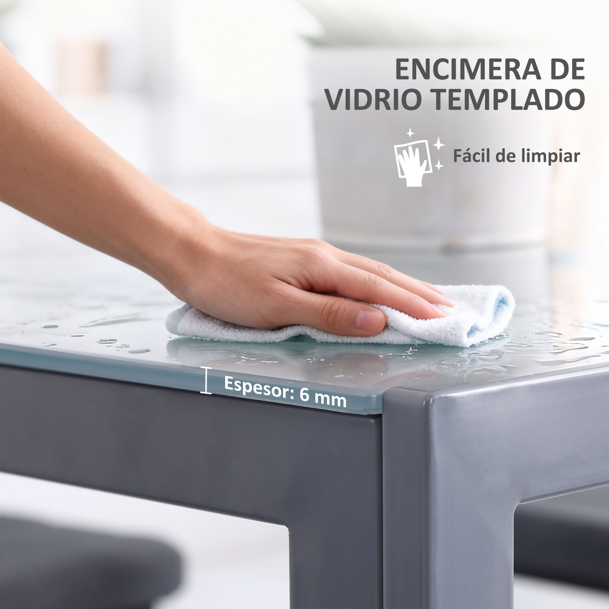 Mano limpia la encimera de vidrio templado con texto.