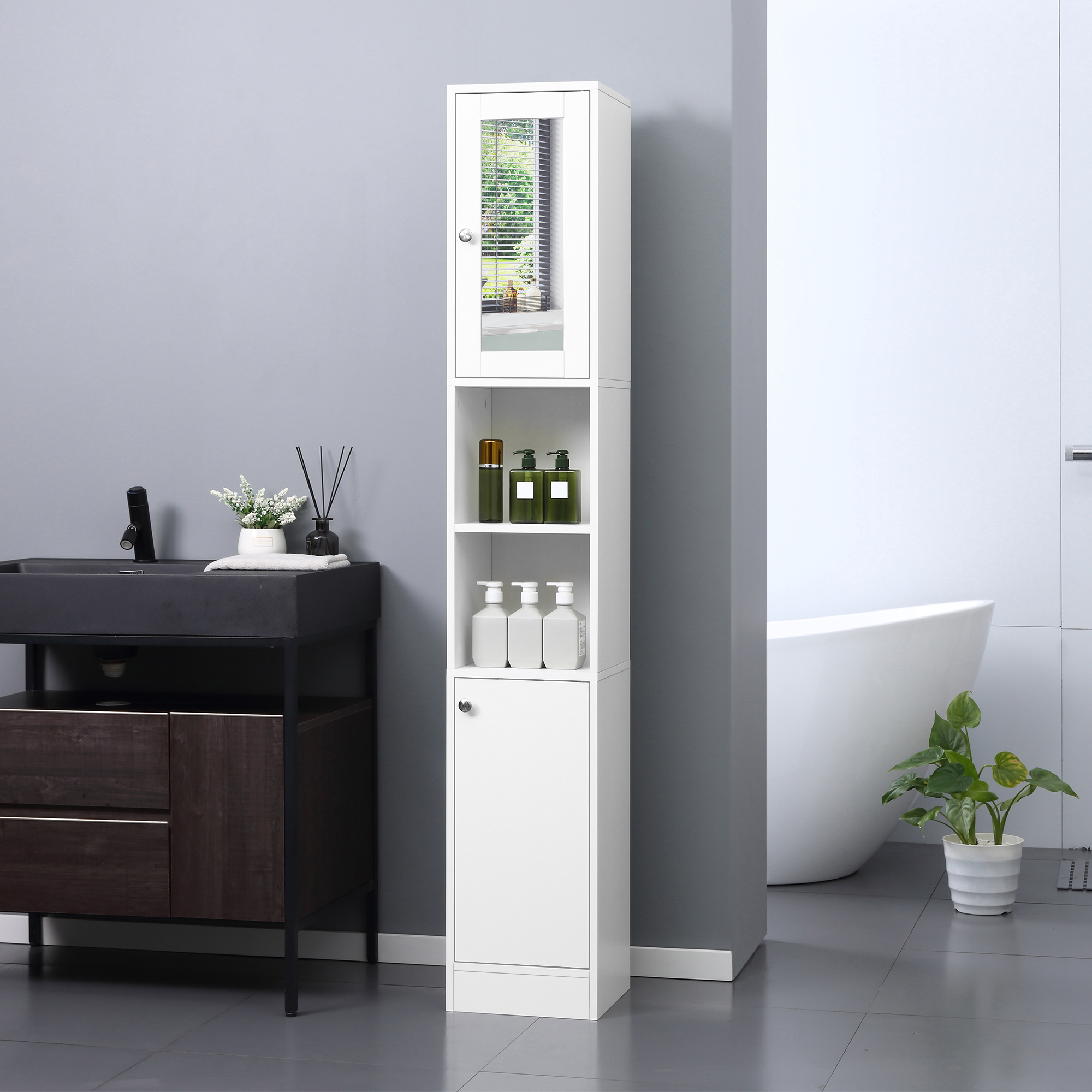 Un armario alto blanco de baño se encuentra entre un tocador oscuro y una bañera en un baño moderno.