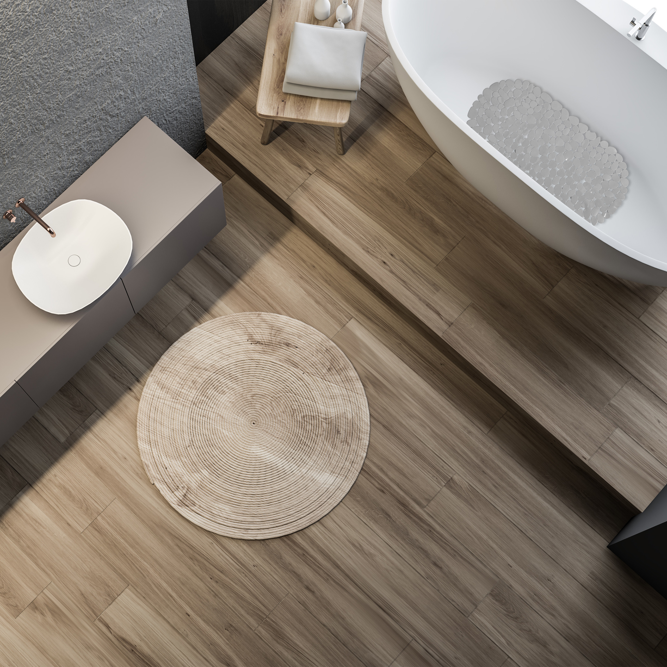 Moderne Badezimmer-Ansicht von oben mit freistehender Badewanne, Waschbecken und Holzböden.
