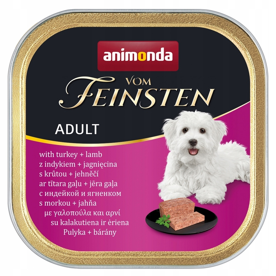 Puszka karm dla psa Animonda Vom Feinsten z białym psem i kawałkami mięsa na różowym tle.