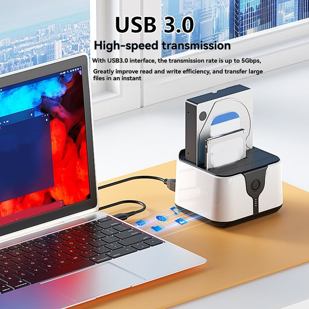 Ein Laptop und eine Dual-Festplatten-Dockingstation, verbunden durch ein Kabel.