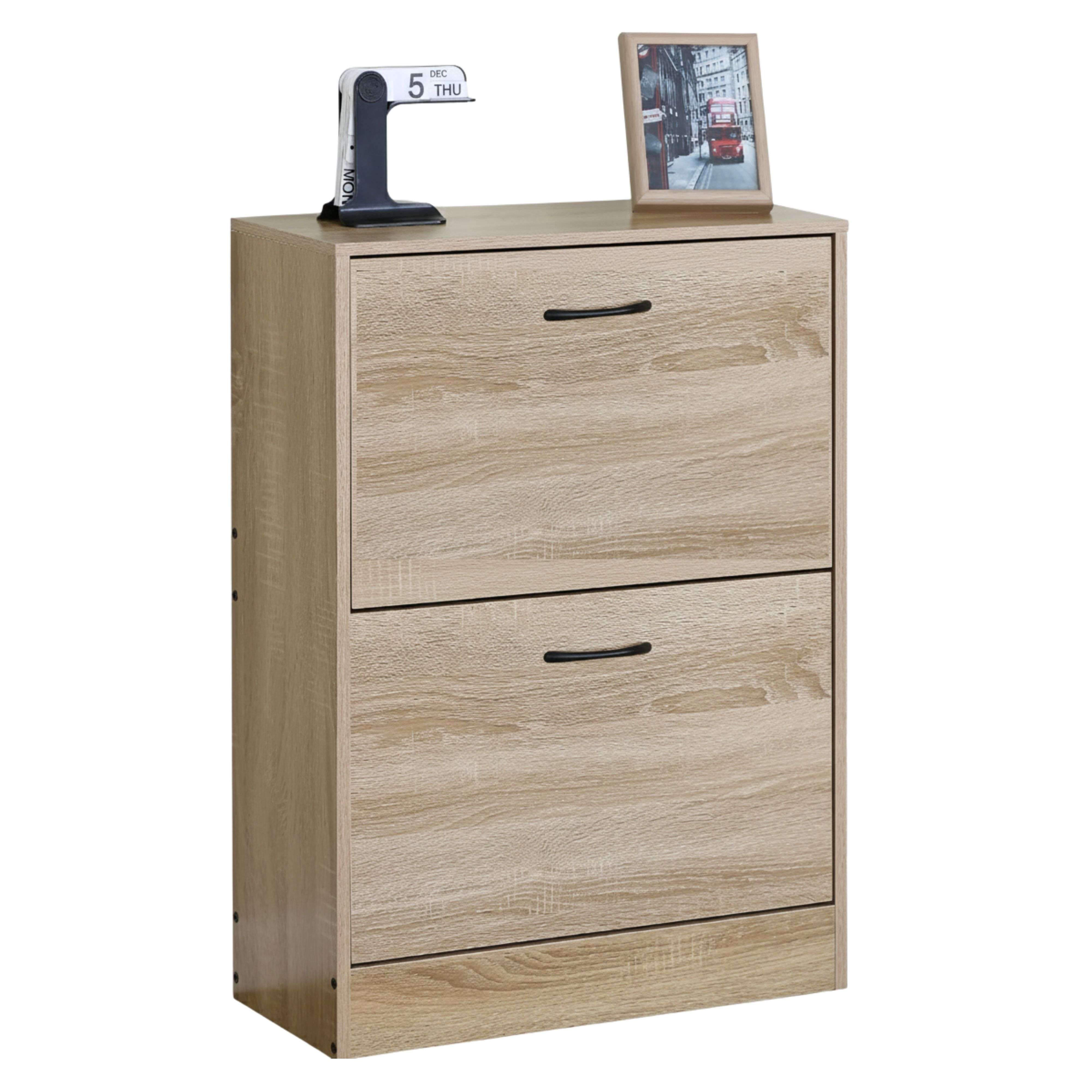 Un zapatero de madera clara con dos cajones abatibles, decorado con un calendario de mesa y un marco.