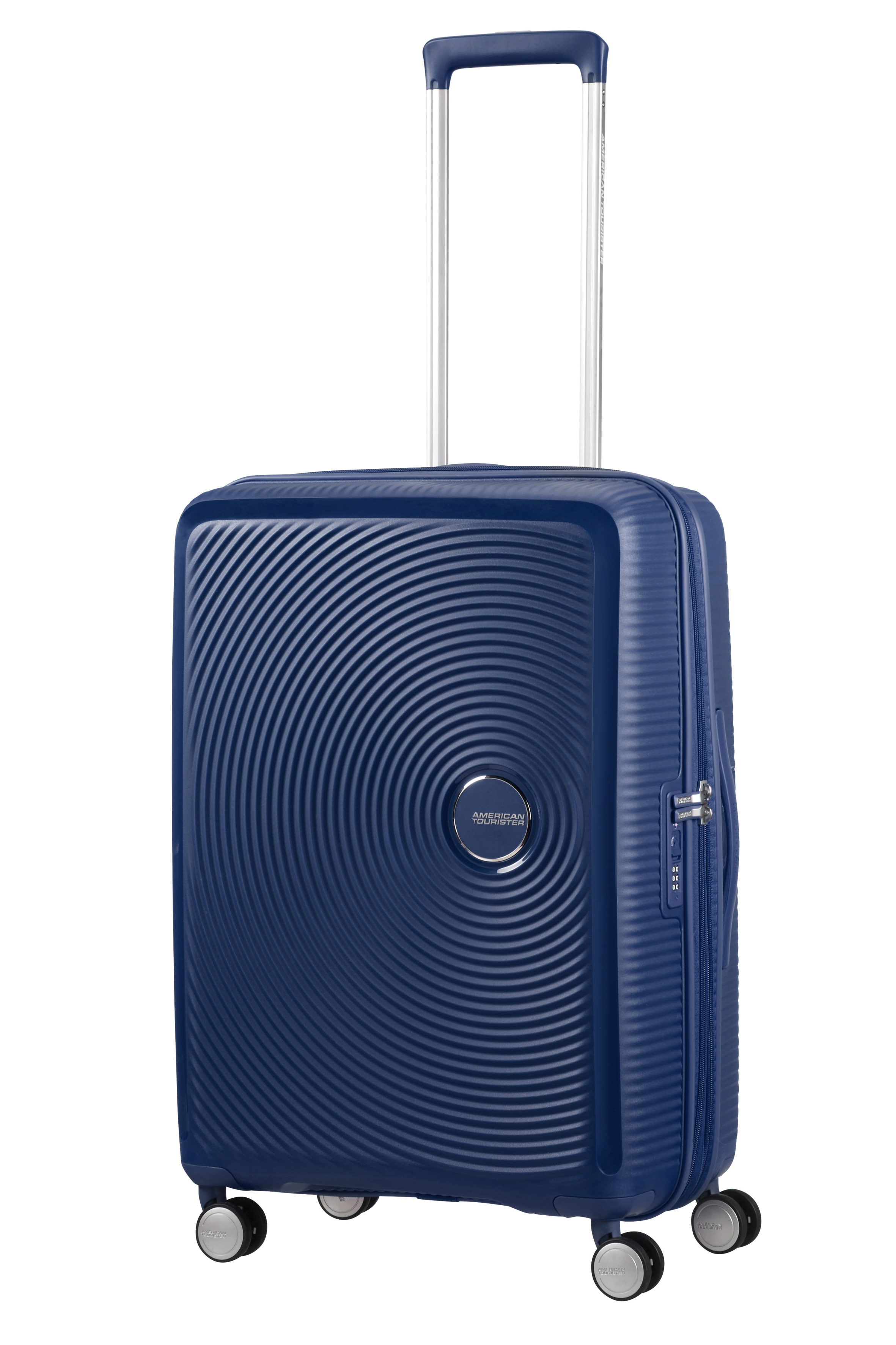 Niebieska walizka twarda American Tourister z wysuwaną rączką, okrągłym wzorem i czterema kółkami.