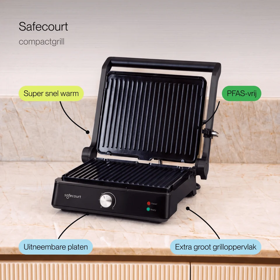 A black Safecourt compact grill on a marble countertop with descriptive text labels.