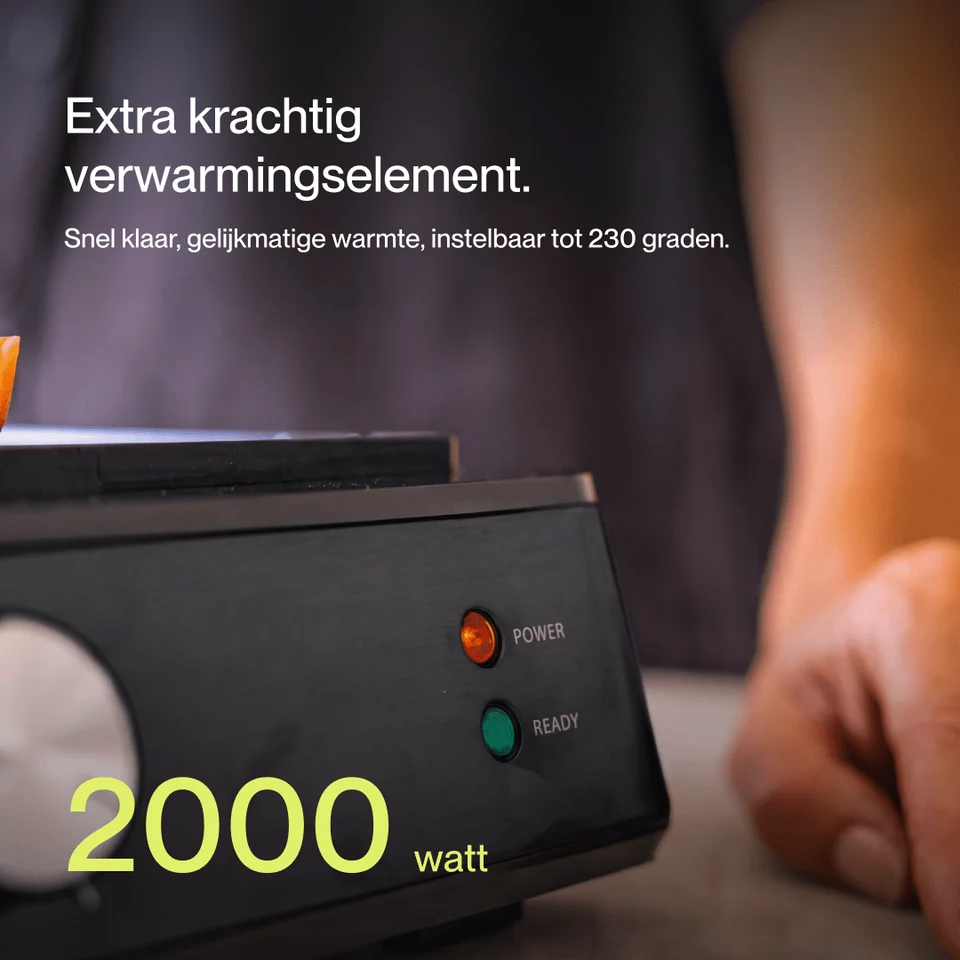 A black kitchen appliance with power and ready indicator lights and the text 2000 watt displayed.