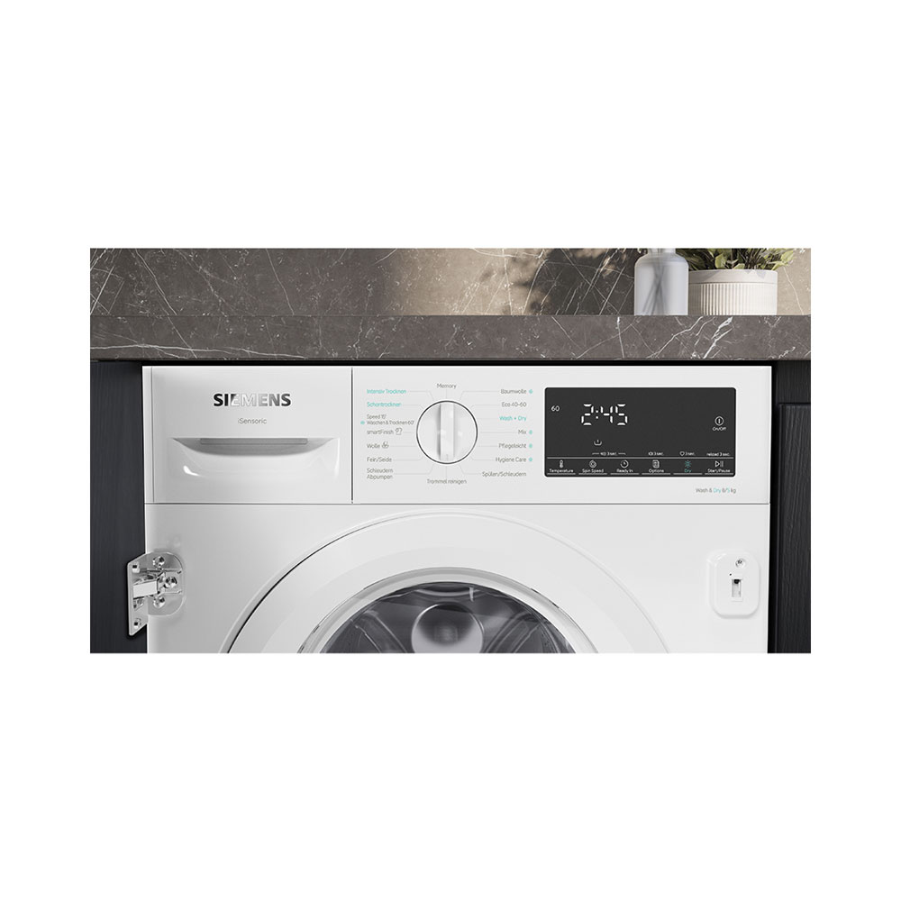 Lave-linge blanc Siemens avec bandeau de commande noir, sélecteur rotatif et affichage numérique sous plan de travail.