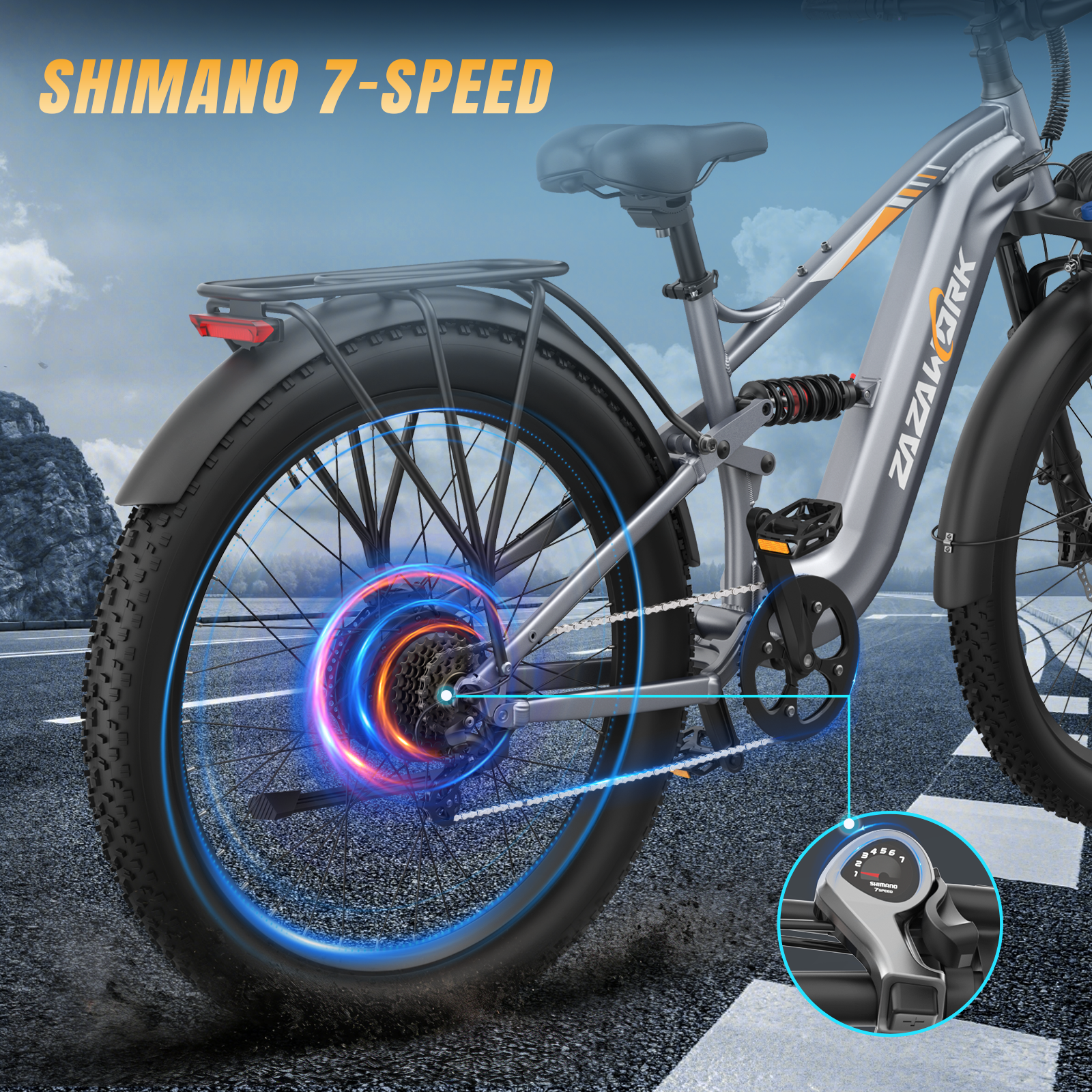 Una bicicletta elettrica grigia con pneumatici larghi, portapacchi, sospensioni e sistema a 7 velocità Shimano.