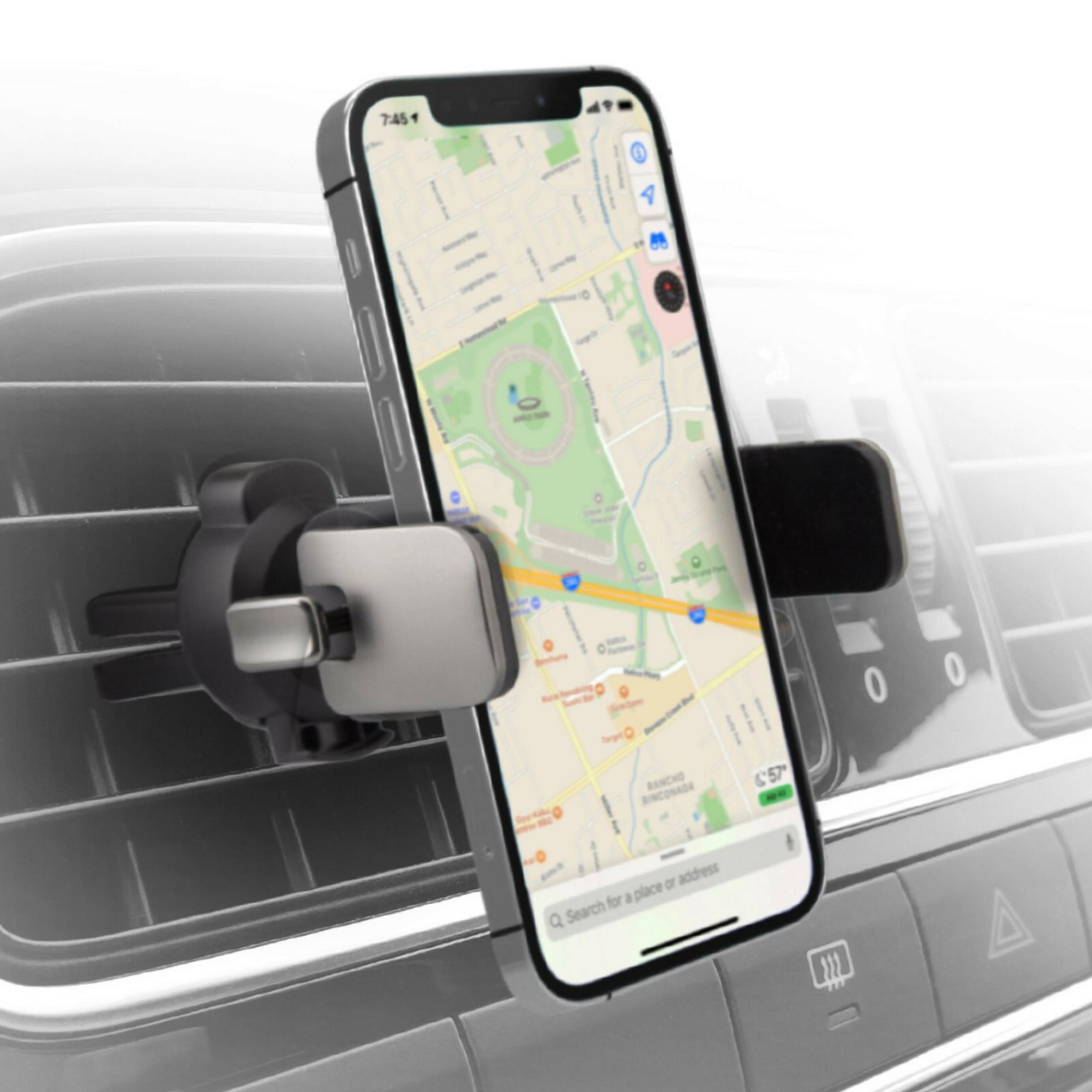 Uno smartphone con un'app di mappe è montato sulla bocchetta dell'aria dell'auto.
