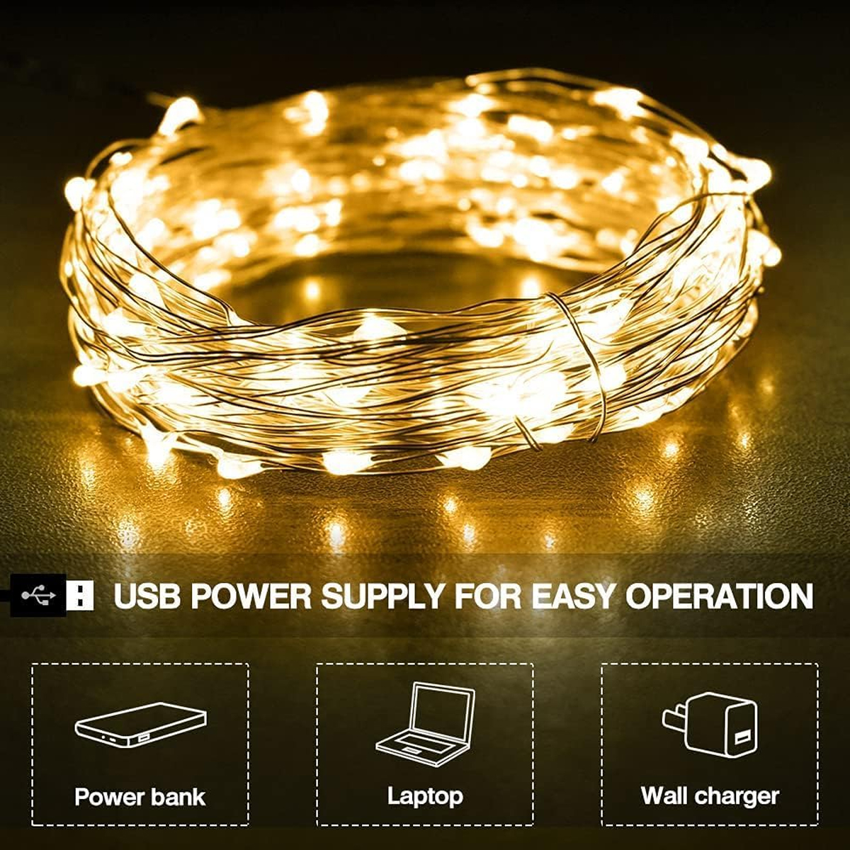 Ein Knäuel warmweißer Lichterketten auf dunklem Grund, mit USB-Stromquellen-Symbolen unten.