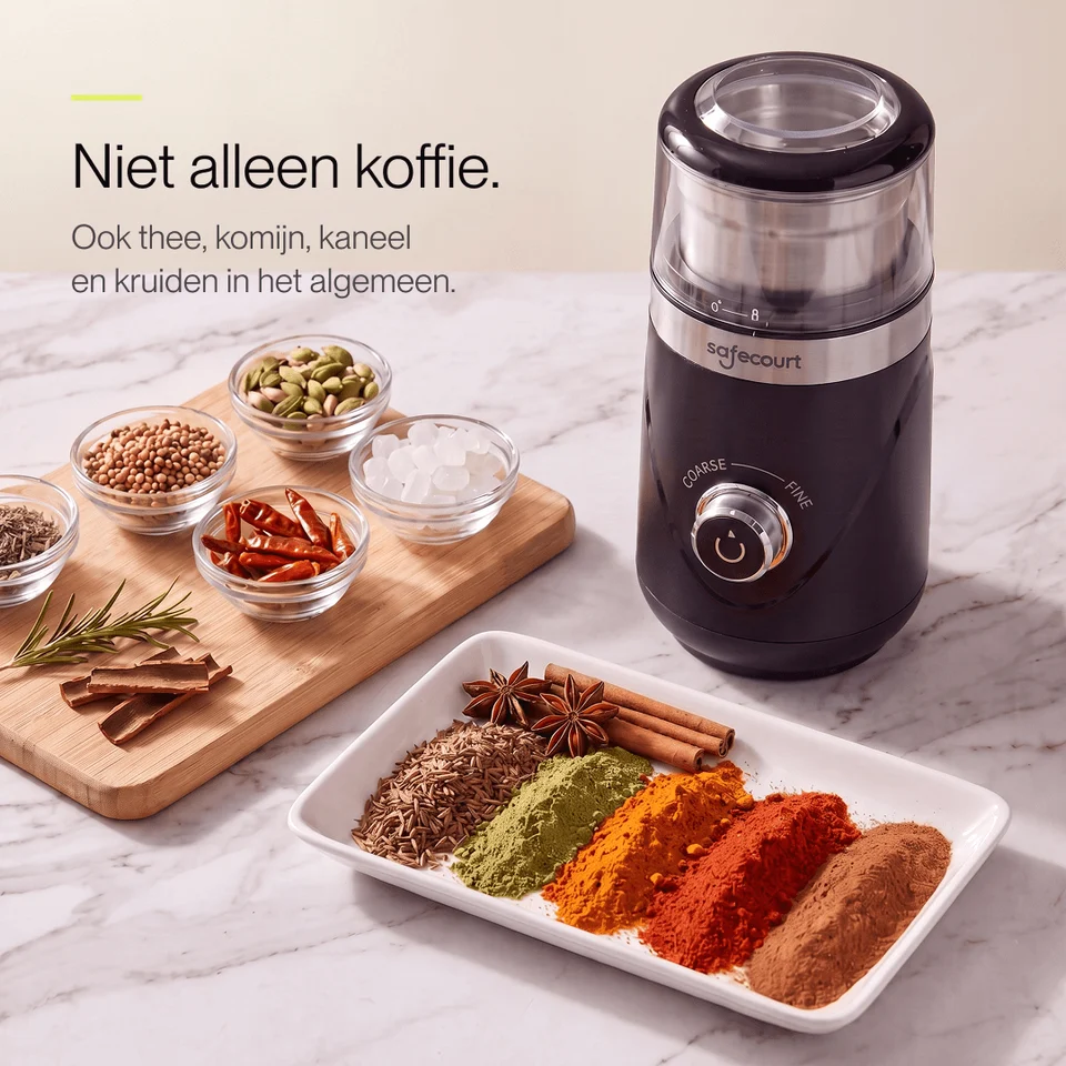 A coffee grinder sits on a marble countertop next to bowls of various spices and Dutch text.