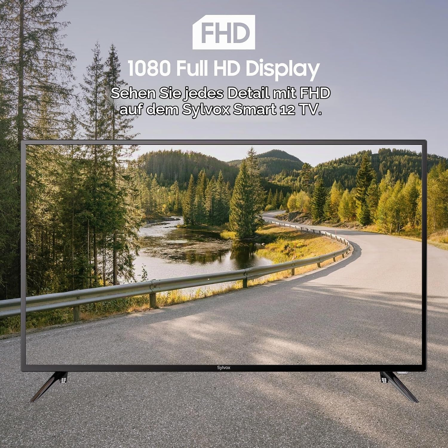 Sylvox Smart 12 TV muestra una carretera sinuosa junto a un río y un bosque en Full HD.
