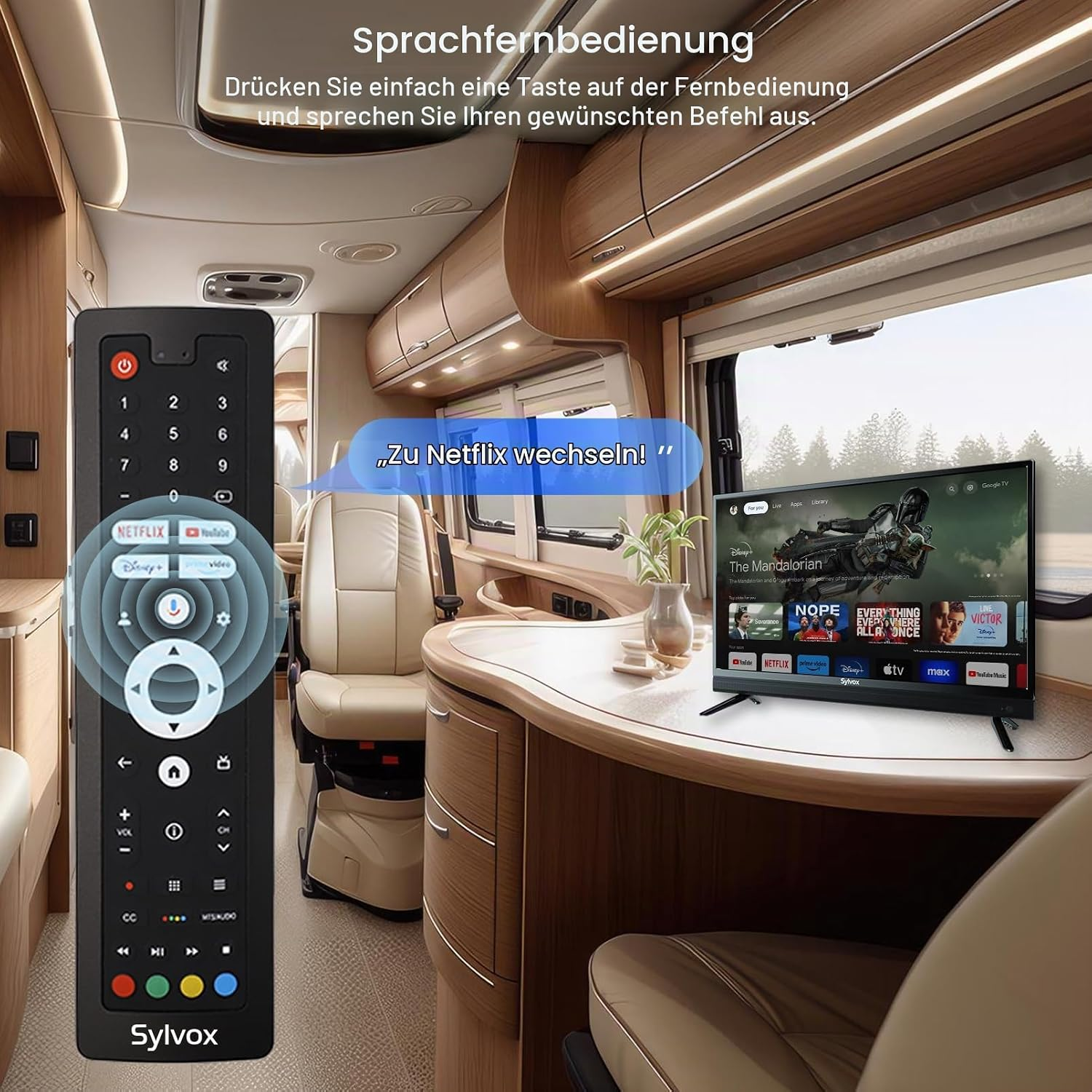 Un control remoto frente al interior de una autocaravana con un televisor en la mesa de madera.