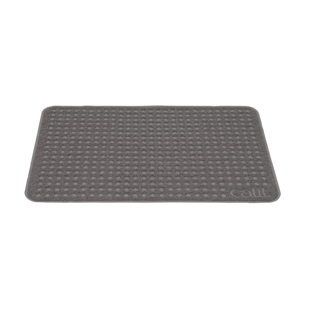 Un tapete gris rectangular para arena de gato con un patrón de lunares texturizado y la marca Catit.