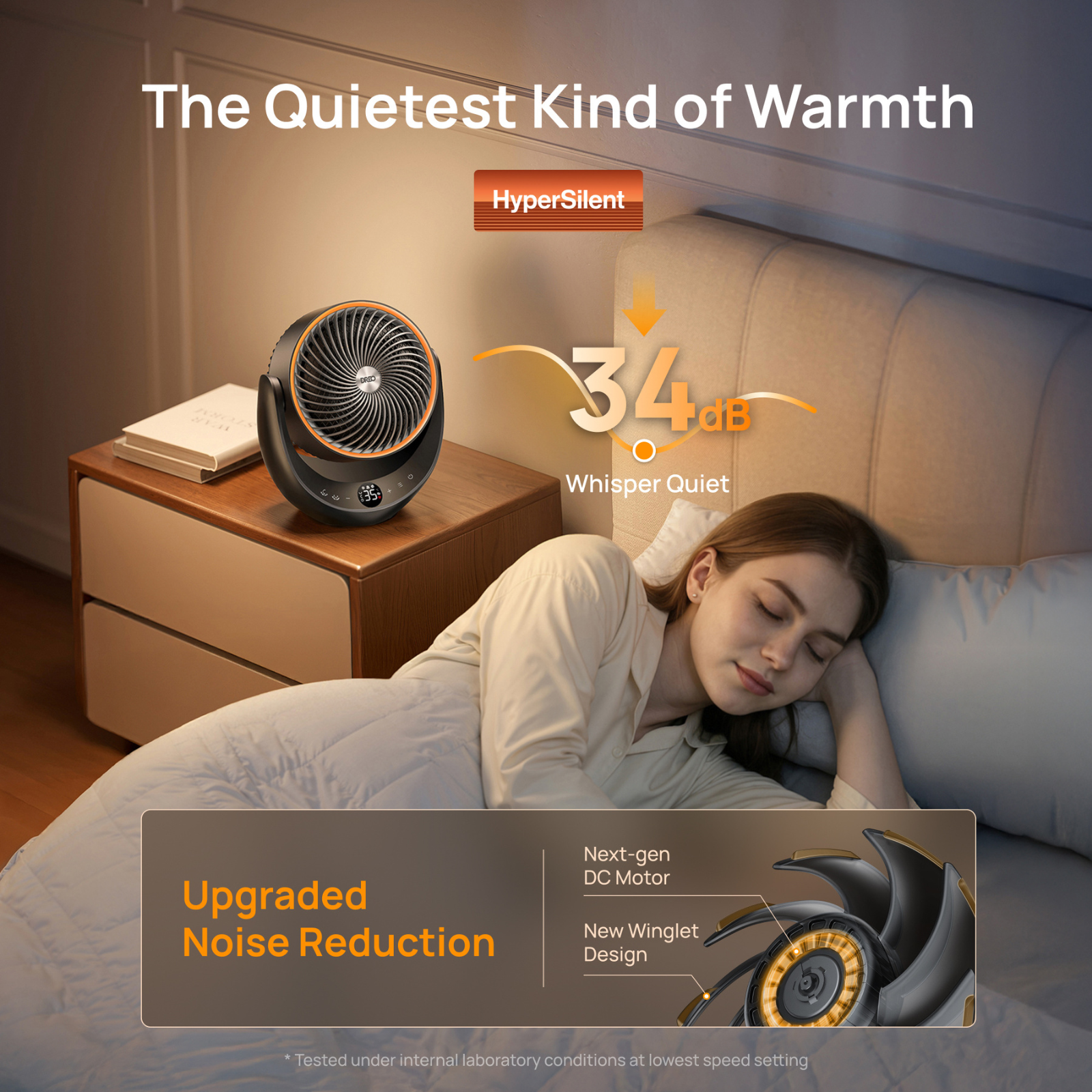 A woman sleeps peacefully in bed next to a quiet bedside fan.