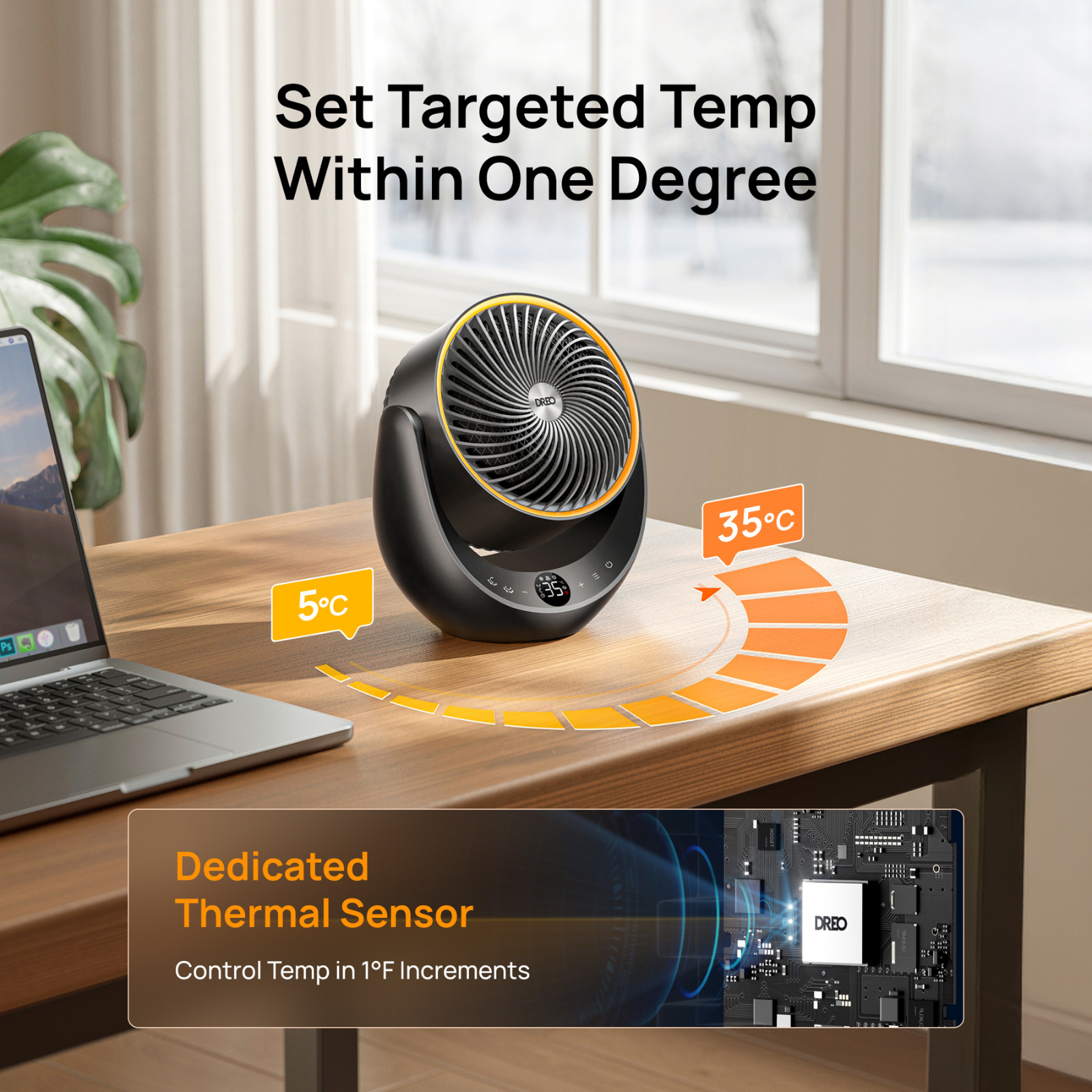 A black desk fan with a digital display and temperature control sits on a wooden desk beside a laptop.