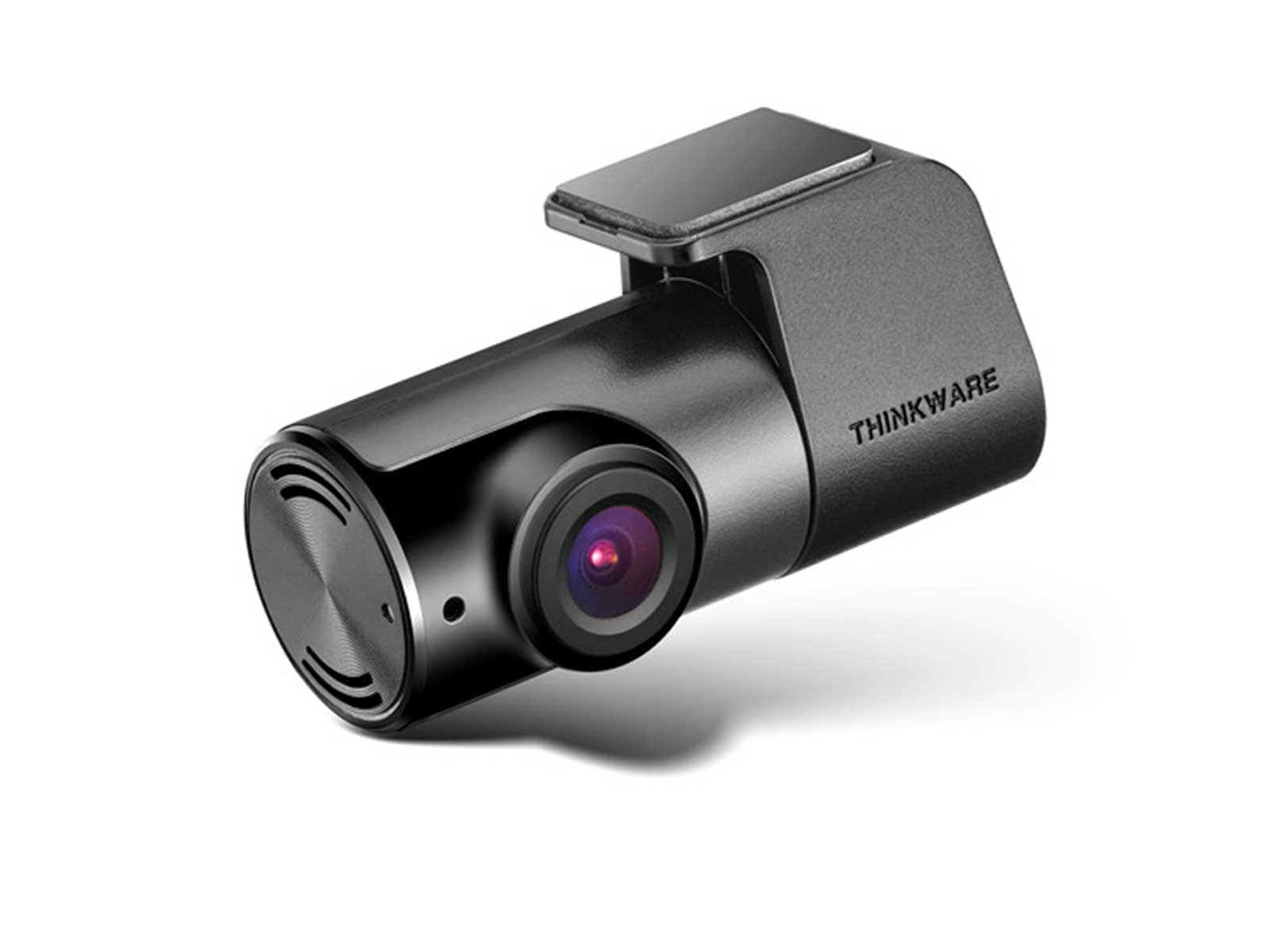 Eine kompakte, schwarze Thinkware Dashcam mit roter Linse und integrierter Halterung auf weißem Hintergrund.