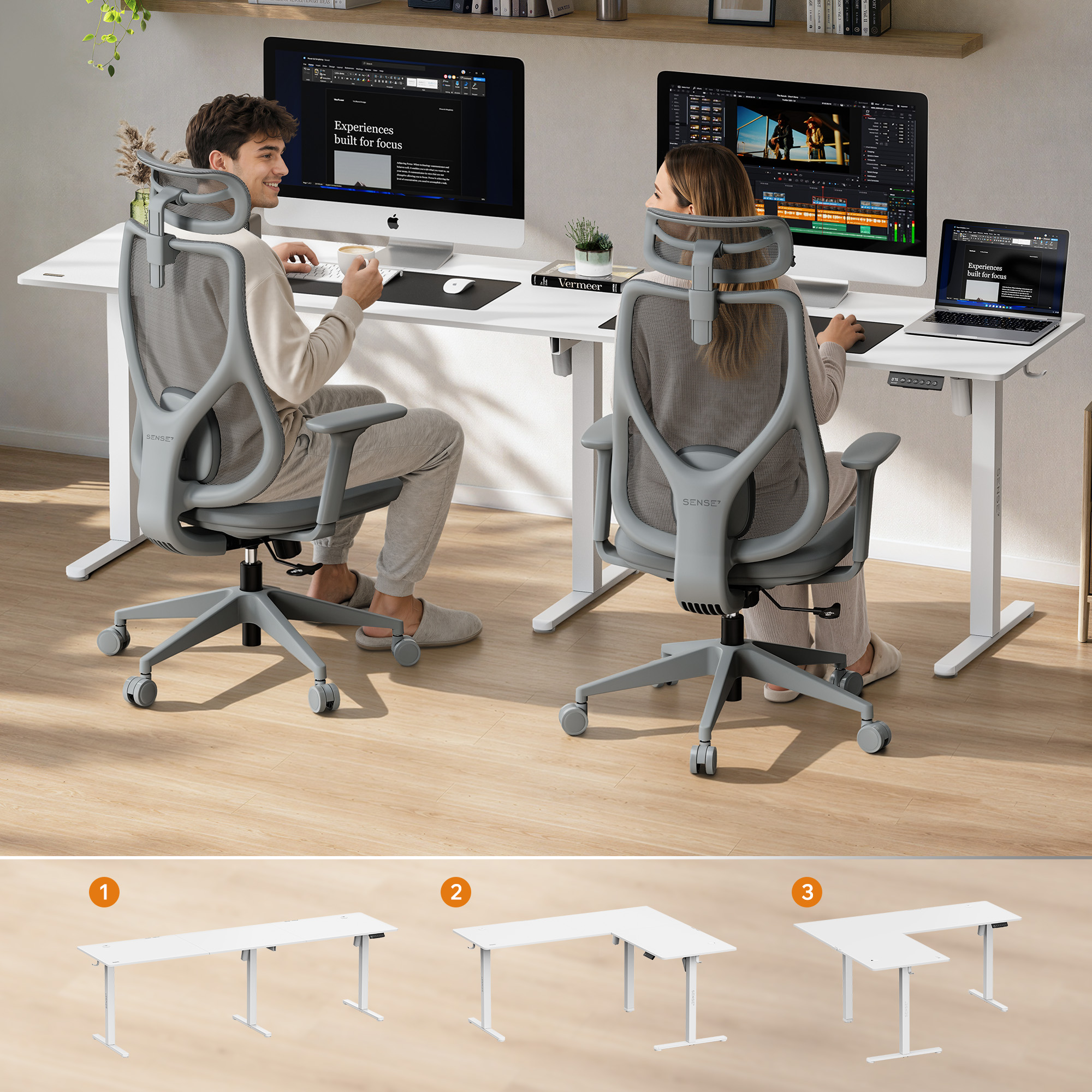 Un uomo e una donna siedono su sedie ergonomiche a una grande scrivania bianca con due monitor.