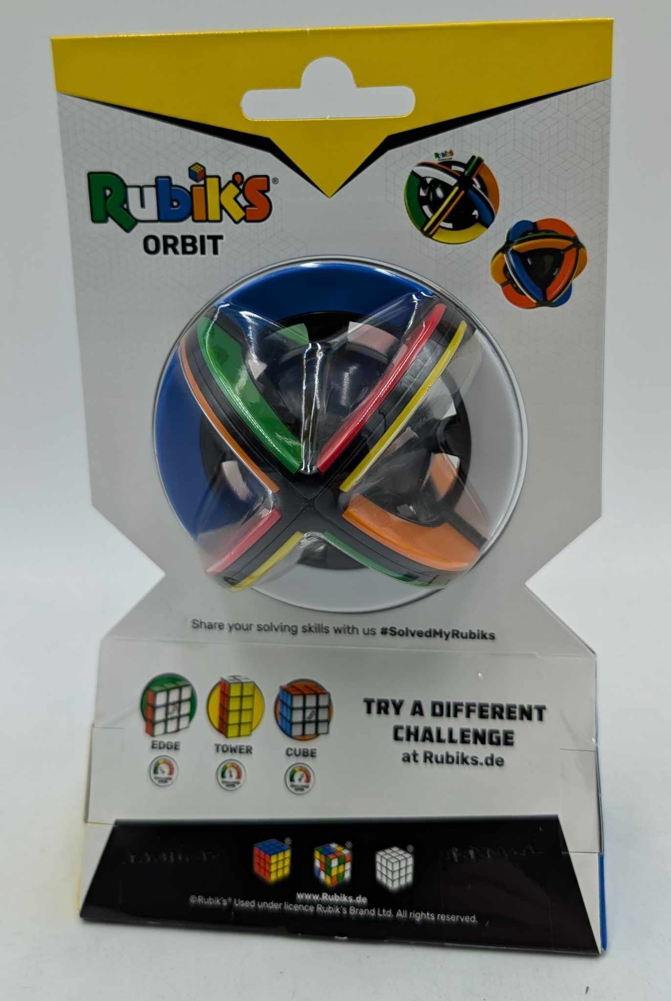 Verpackter Rubik's Orbit Puzzleball in buntem Design mit Branding.