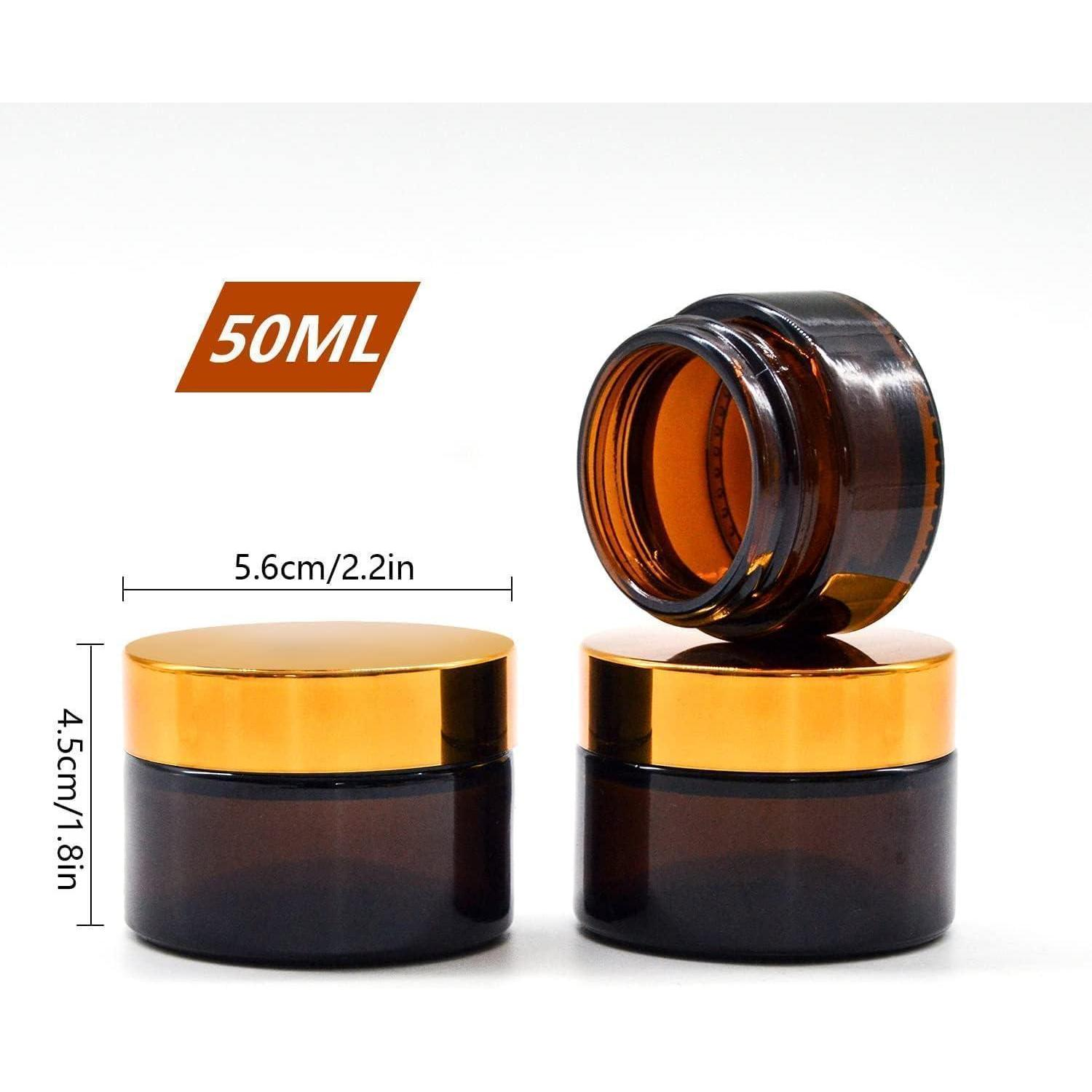 Due contenitori in vetro ambra con coperchi dorati, 50 ml, con etichette di misura.