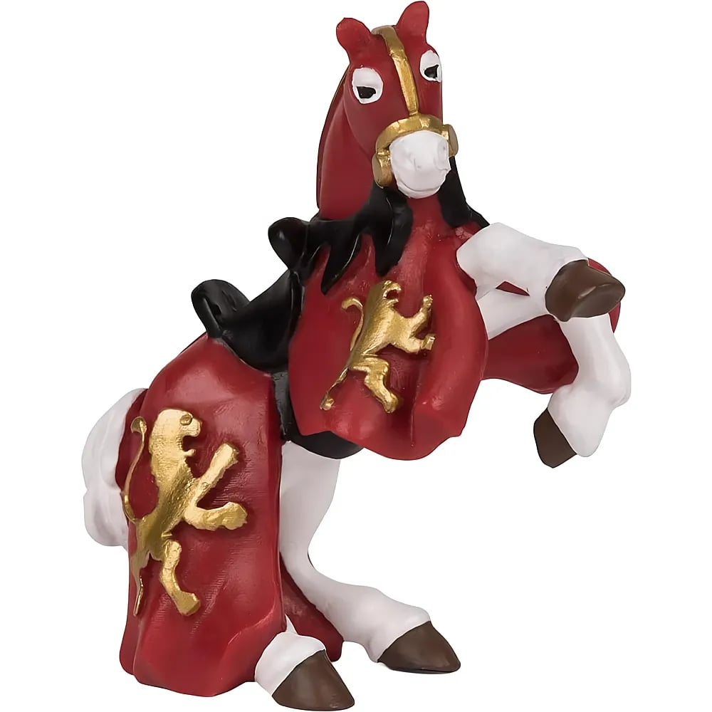 Eine rote Spielzeugpferd-Figur mit goldener Löwenverzierung und einem roten Umhang.