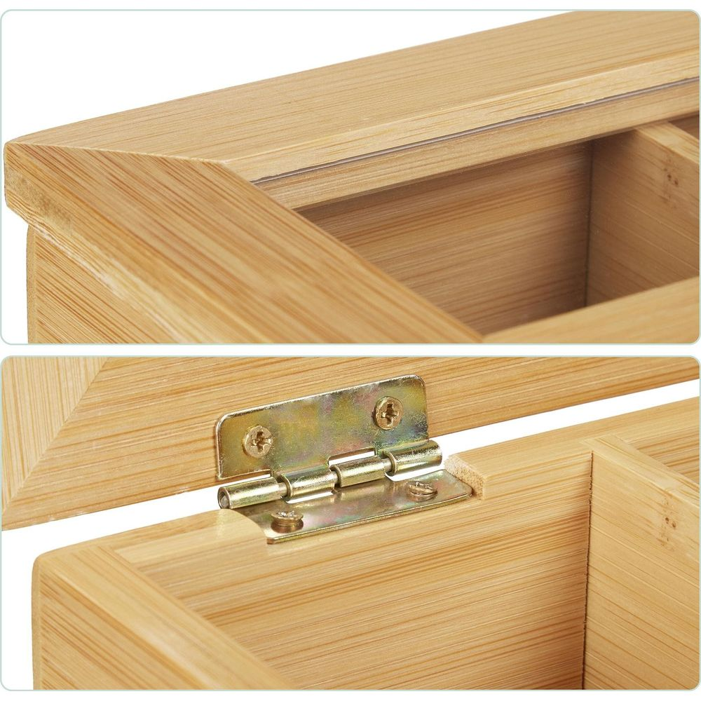 Primo piano di una scatola di legno con coperchio trasparente e cerniera in metallo.